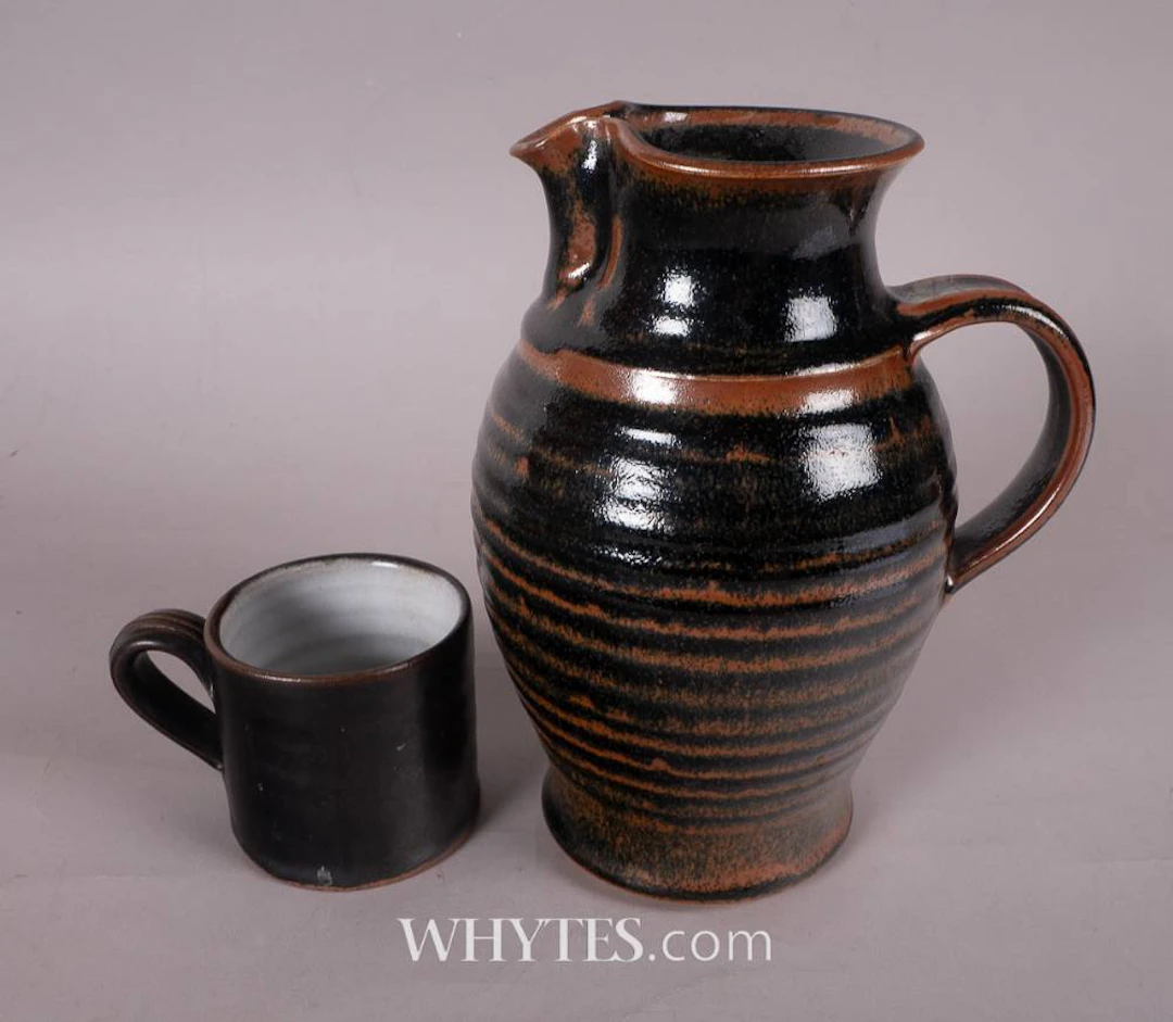 BROWN JAR WITH LID AND SHAMROCK MUG (A PAIR)