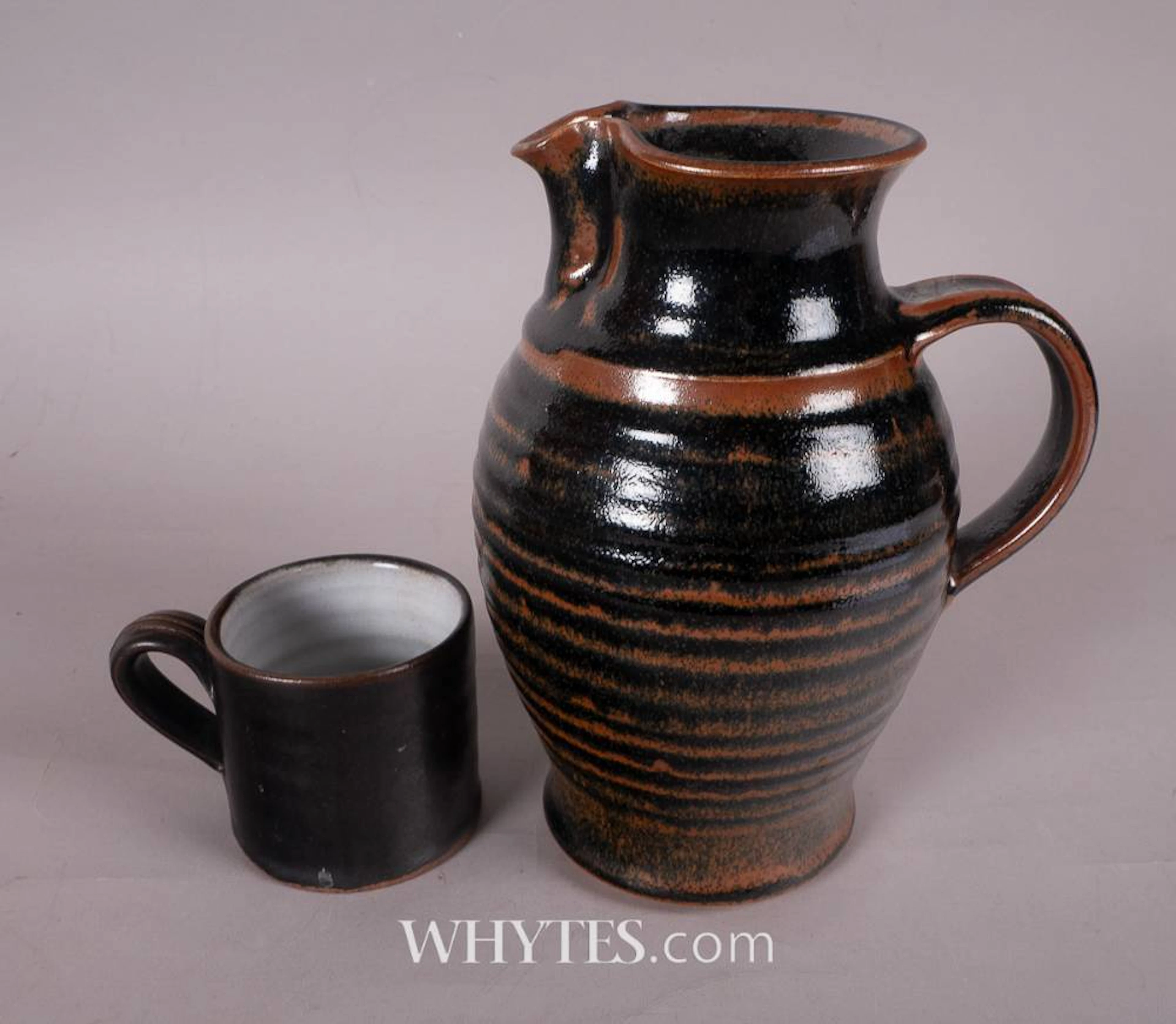 BROWN JAR WITH LID AND SHAMROCK MUG (A PAIR)