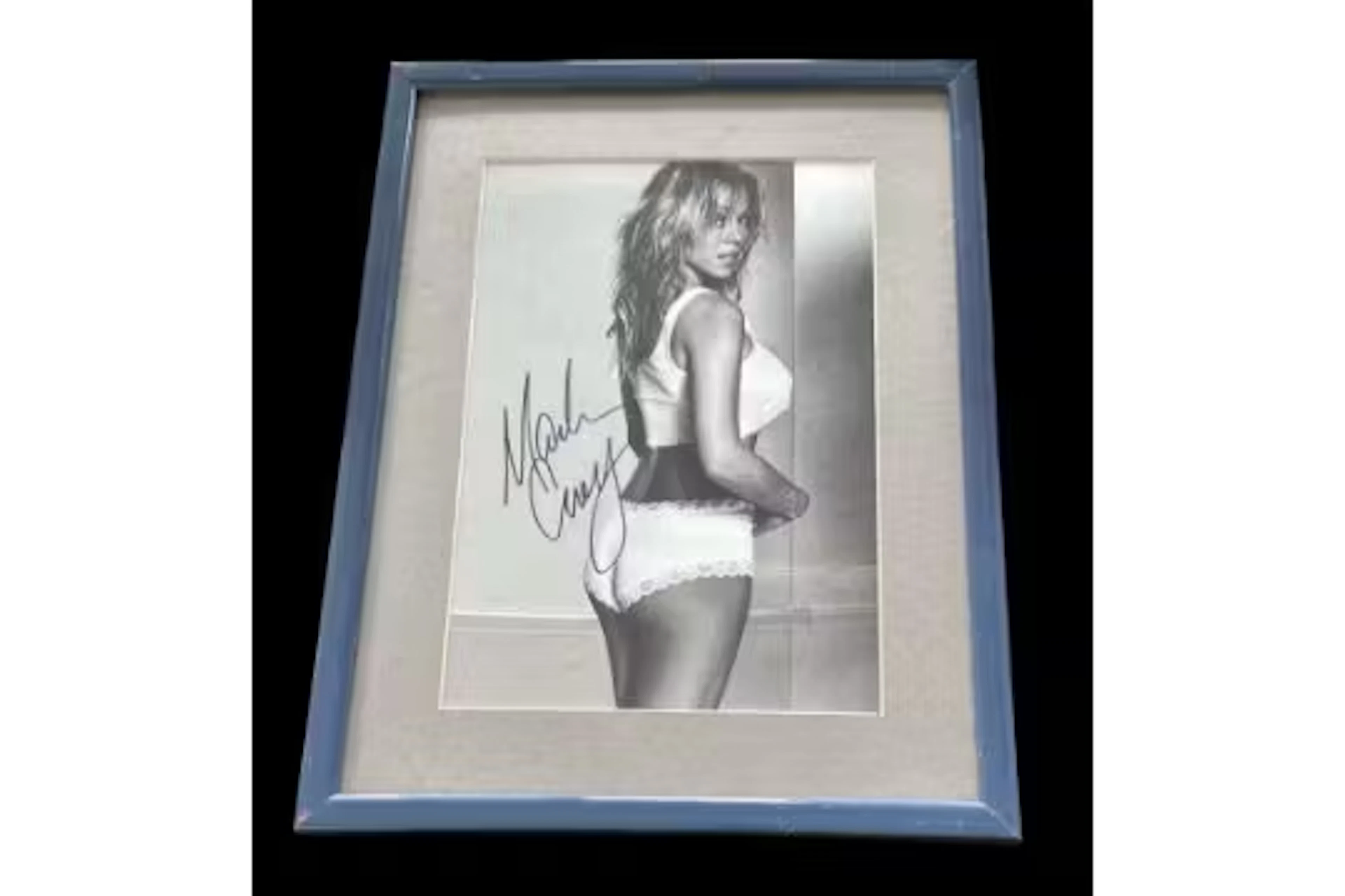 Mariah Carey signed black and white photo. Mounted and framed, measures