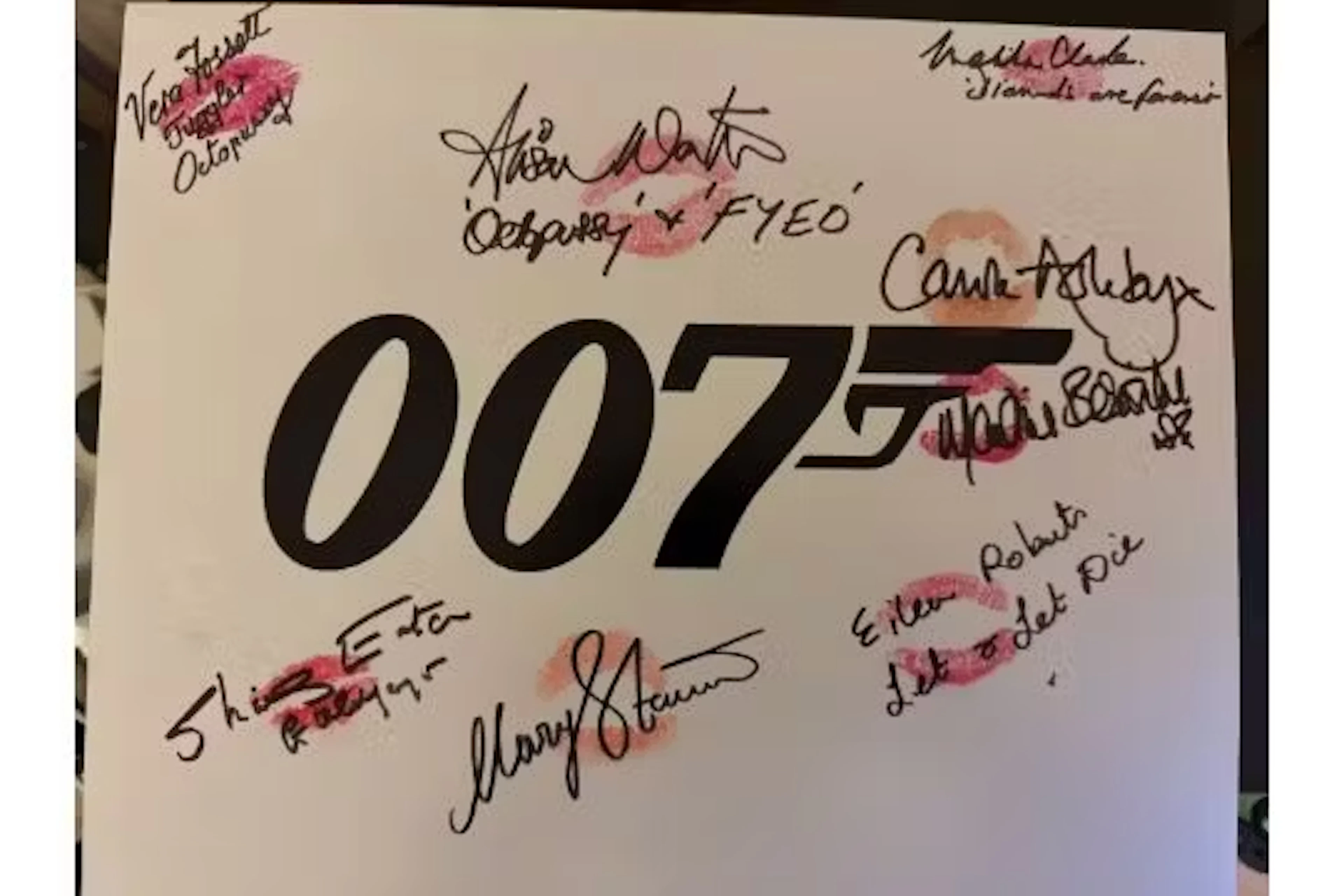 007 James Bond 14x11 inch logo photo signed and personally kissed