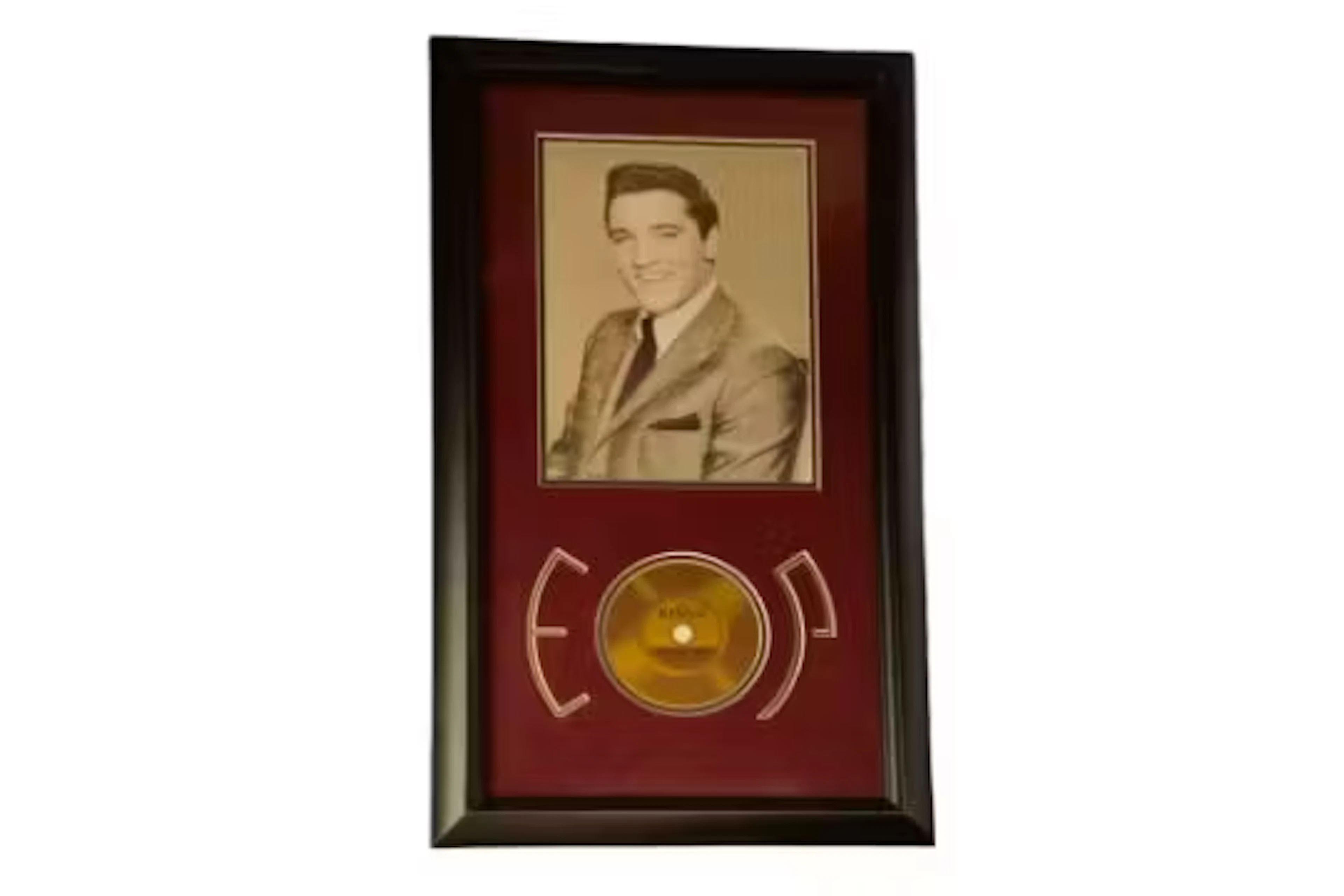 Elvis Presley strand of hair. Gold record contains a strand of hair