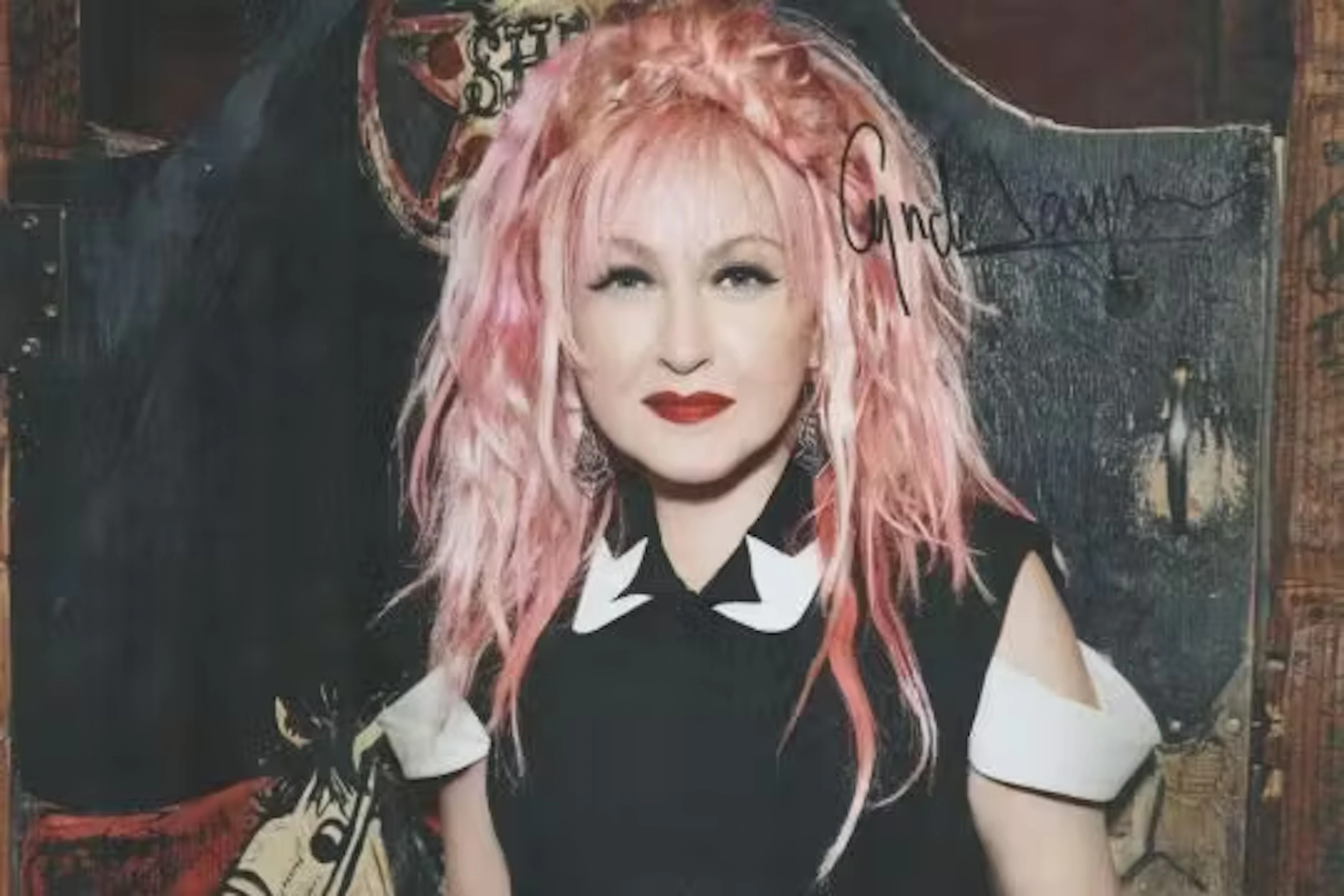 Cyndi Lauper signed 12x8inch colour photo. Good condition. All autographs