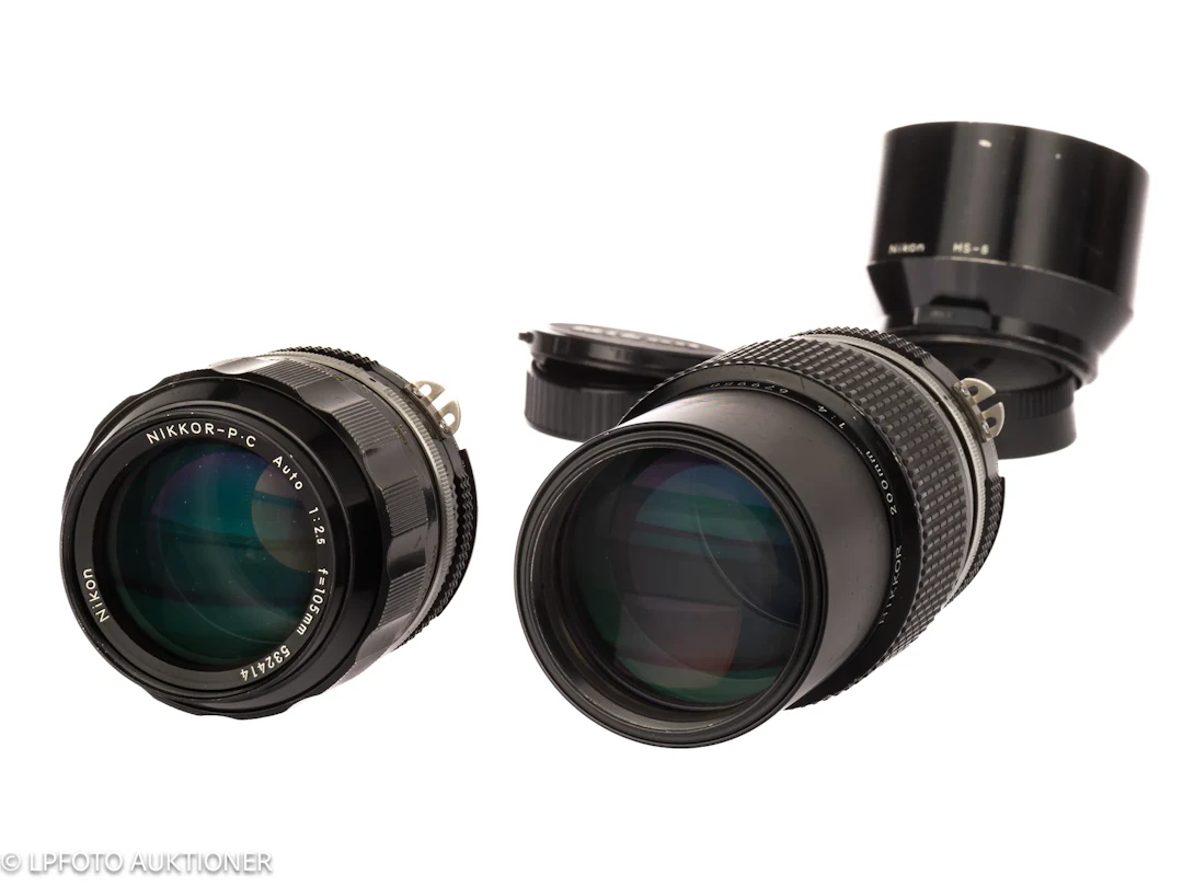 Lot with two Nikkor lenses
