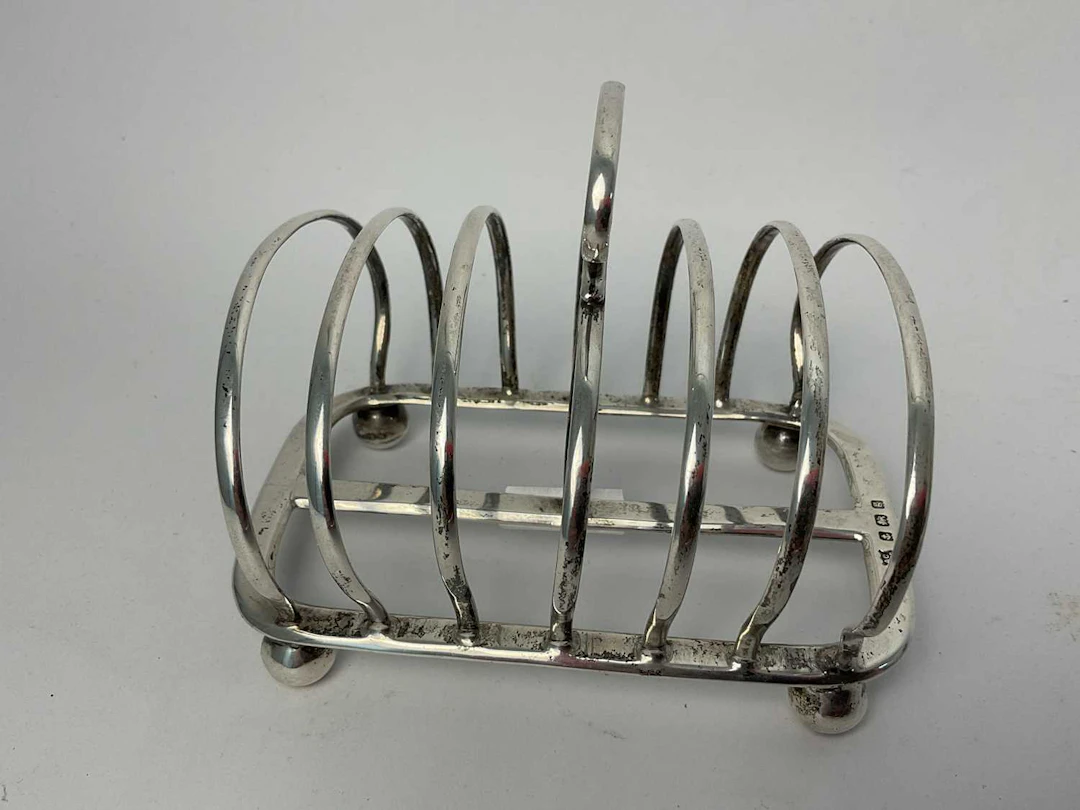 THE ALEXANDER CLARK MANUFACTURING CO; a Edward VII hallmarked silver toast rack
