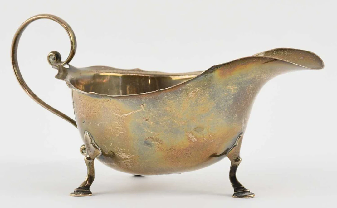 A George V hallmarked silver sauceboat