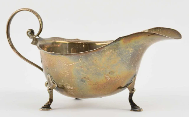 A George V hallmarked silver sauceboat