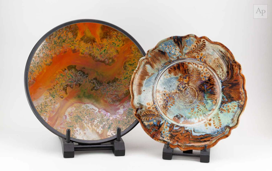 ANDREW HILL (born 1964); a raku charger covered in burnt...