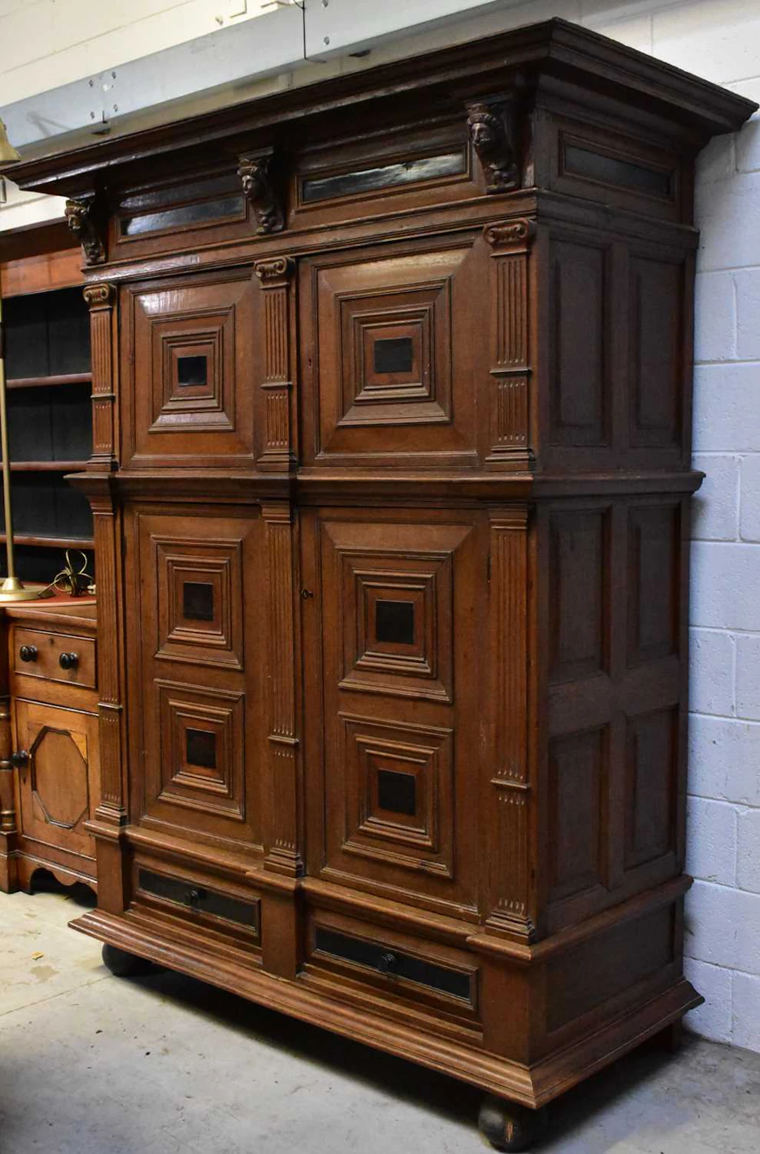 An 18th century Dutch oak and ebony kussenkast cupboard