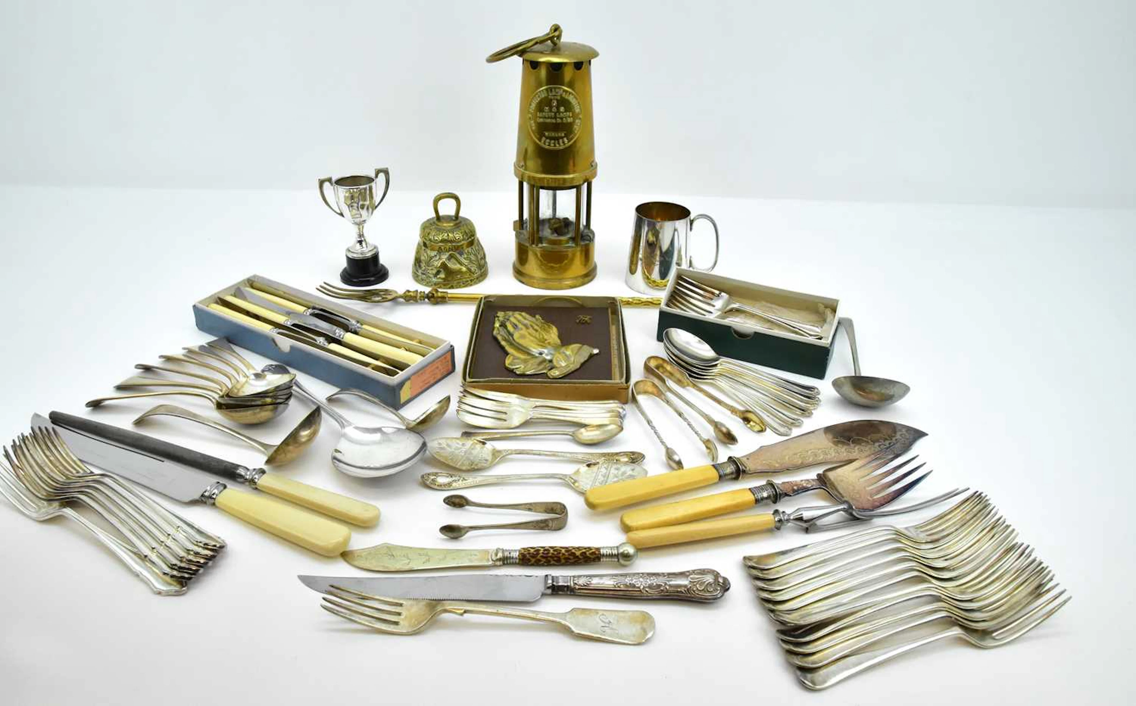 Various items of silver plated cutlery including ladles
