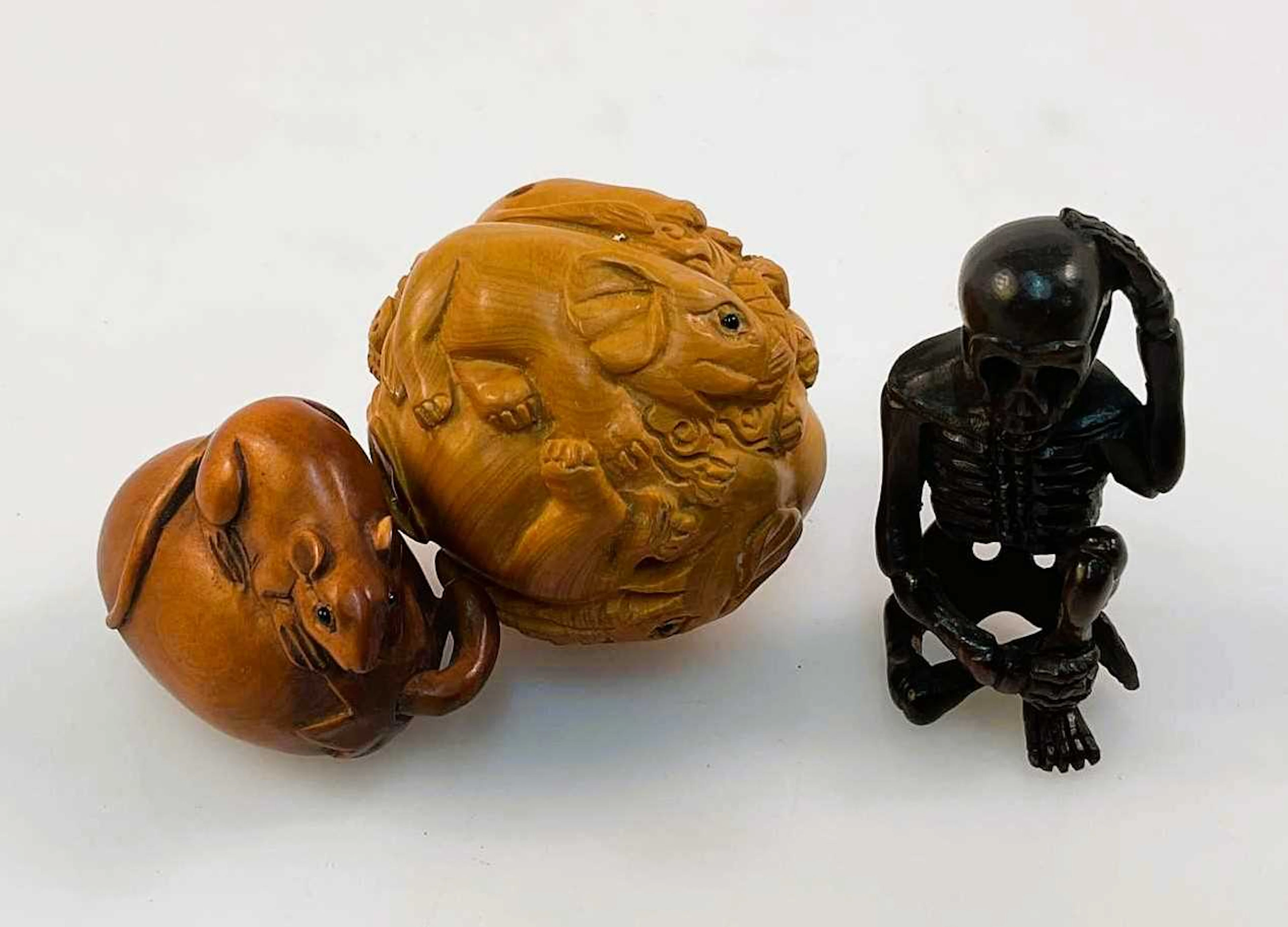 Three 20th century netsukes comprising a rat