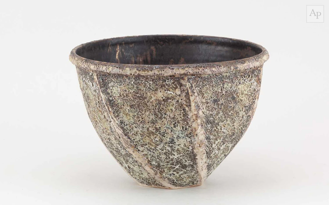 CHRIS CARTER (born 1945); a deep faceted stoneware bowl...