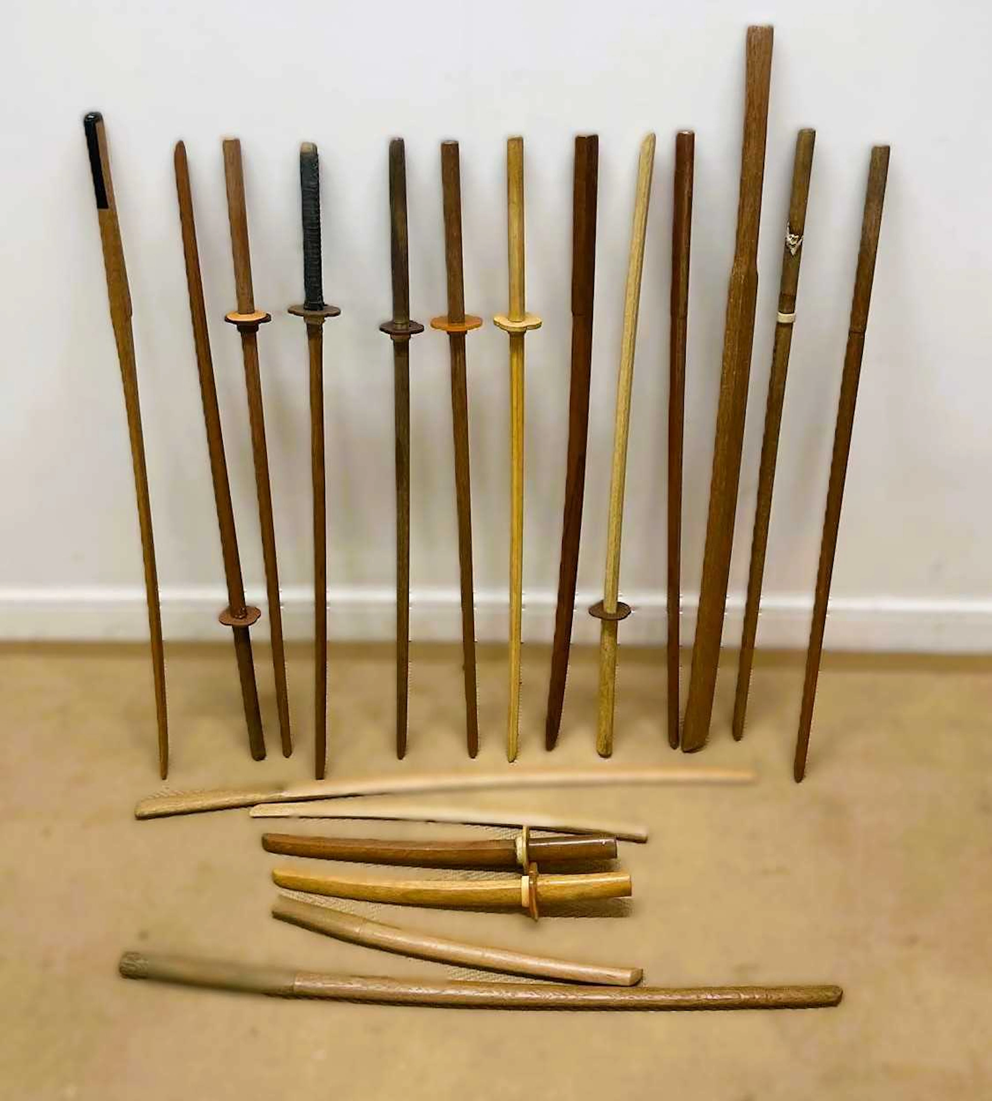 A quantity of Japanese oak Bokken and Tanto training swords