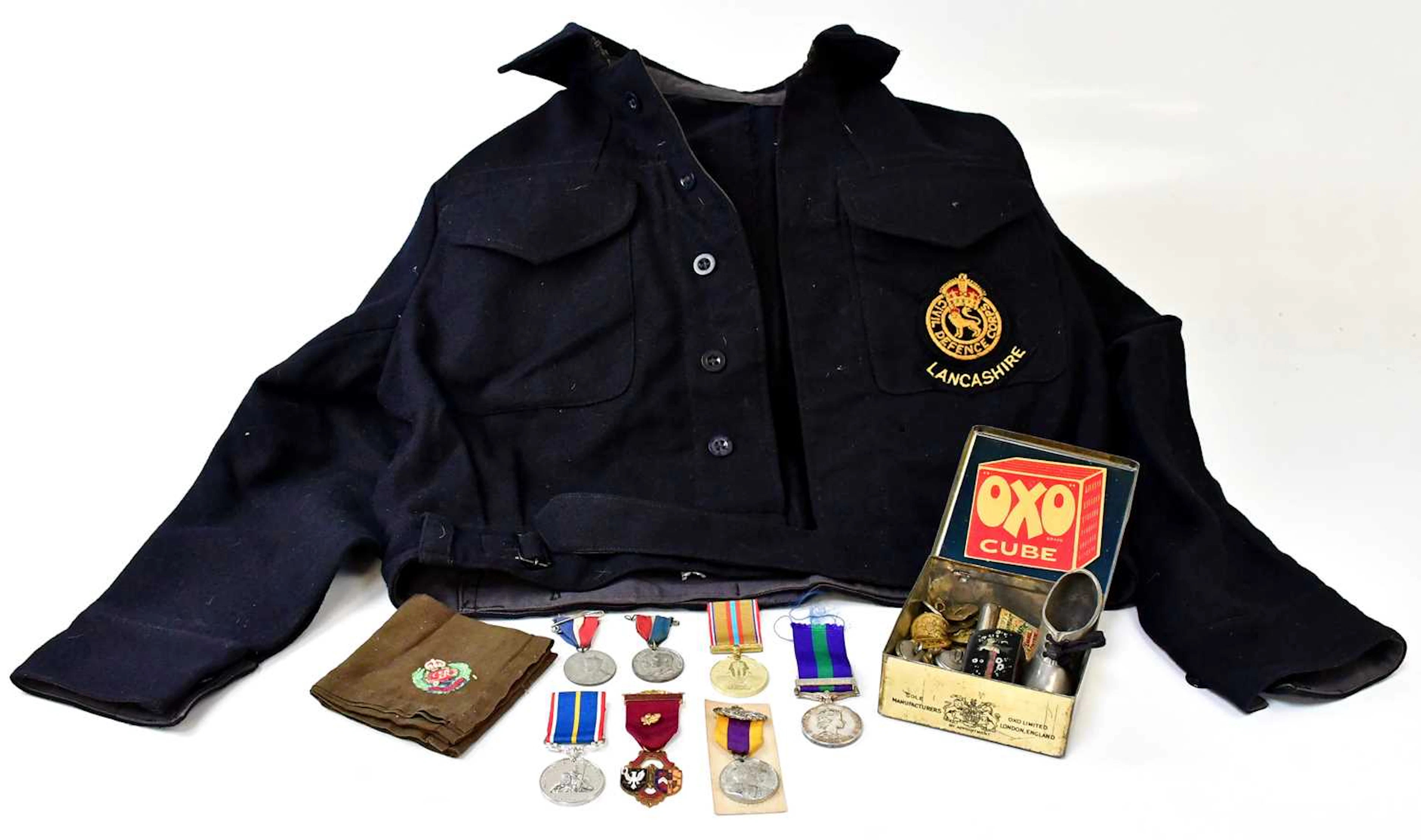 A WWII warden's blue felt jacket with Lancashire Civil Defence Corps badge