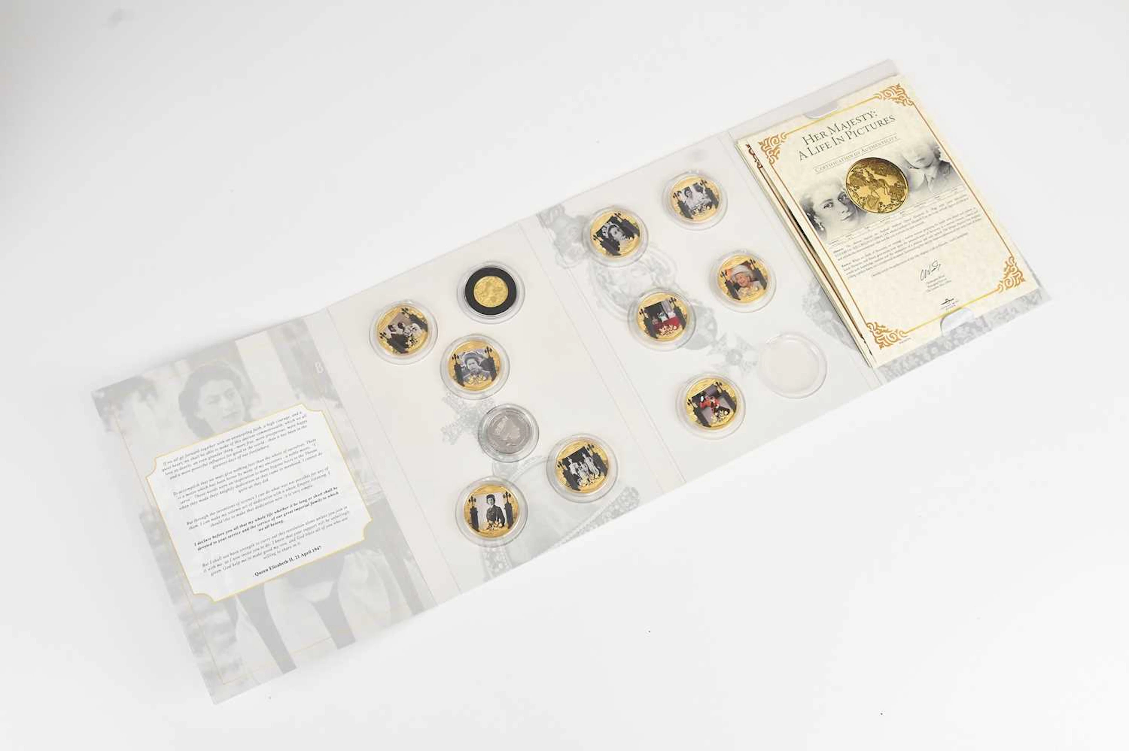 A 'Her Majesty A Life in Pictures' part coin set