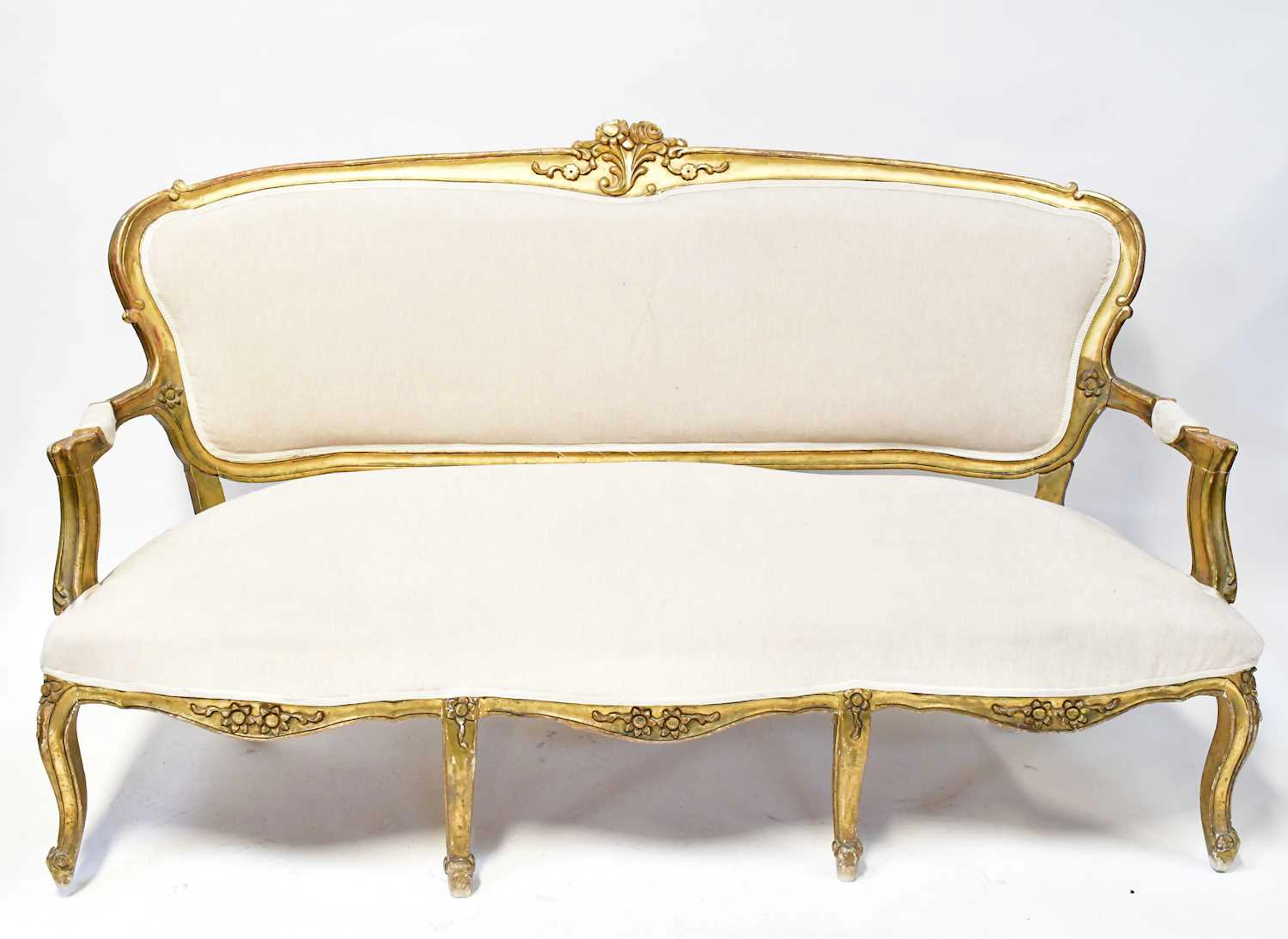 A 19th century Louis XV style giltwood three-piece suite...