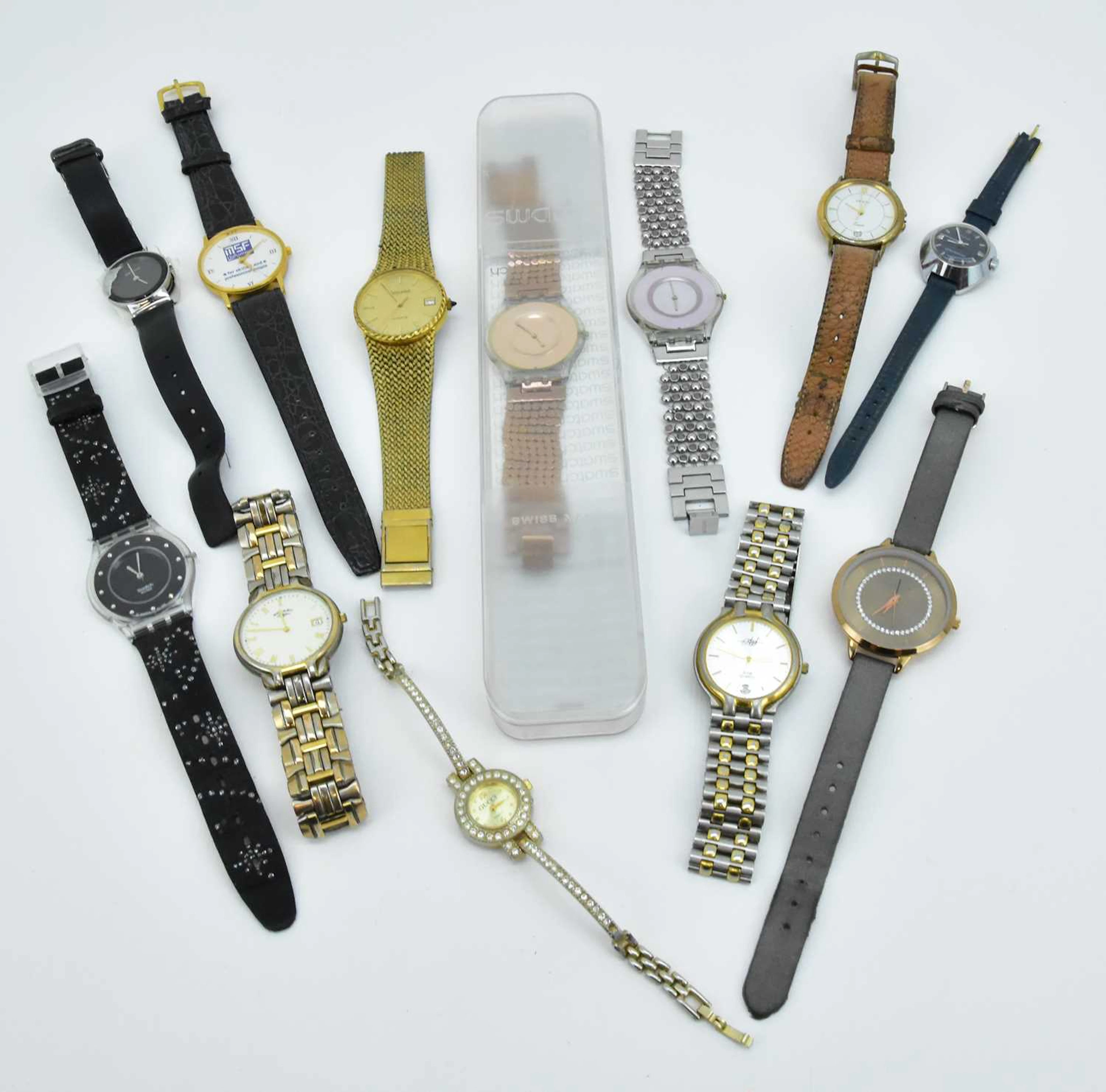 A collection of wristwatches including Swatch