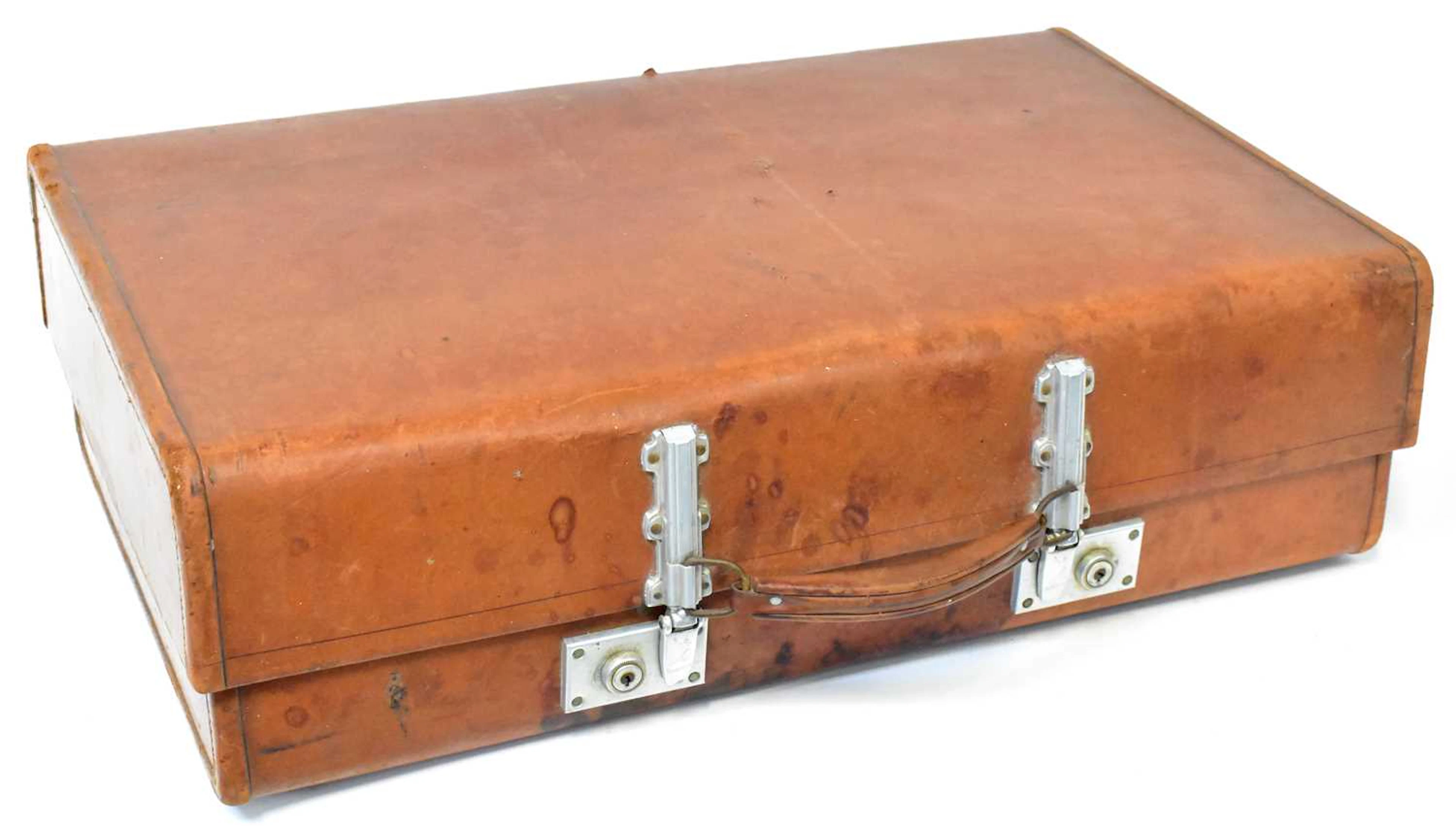A vintage tan leather suitcase by Revelation