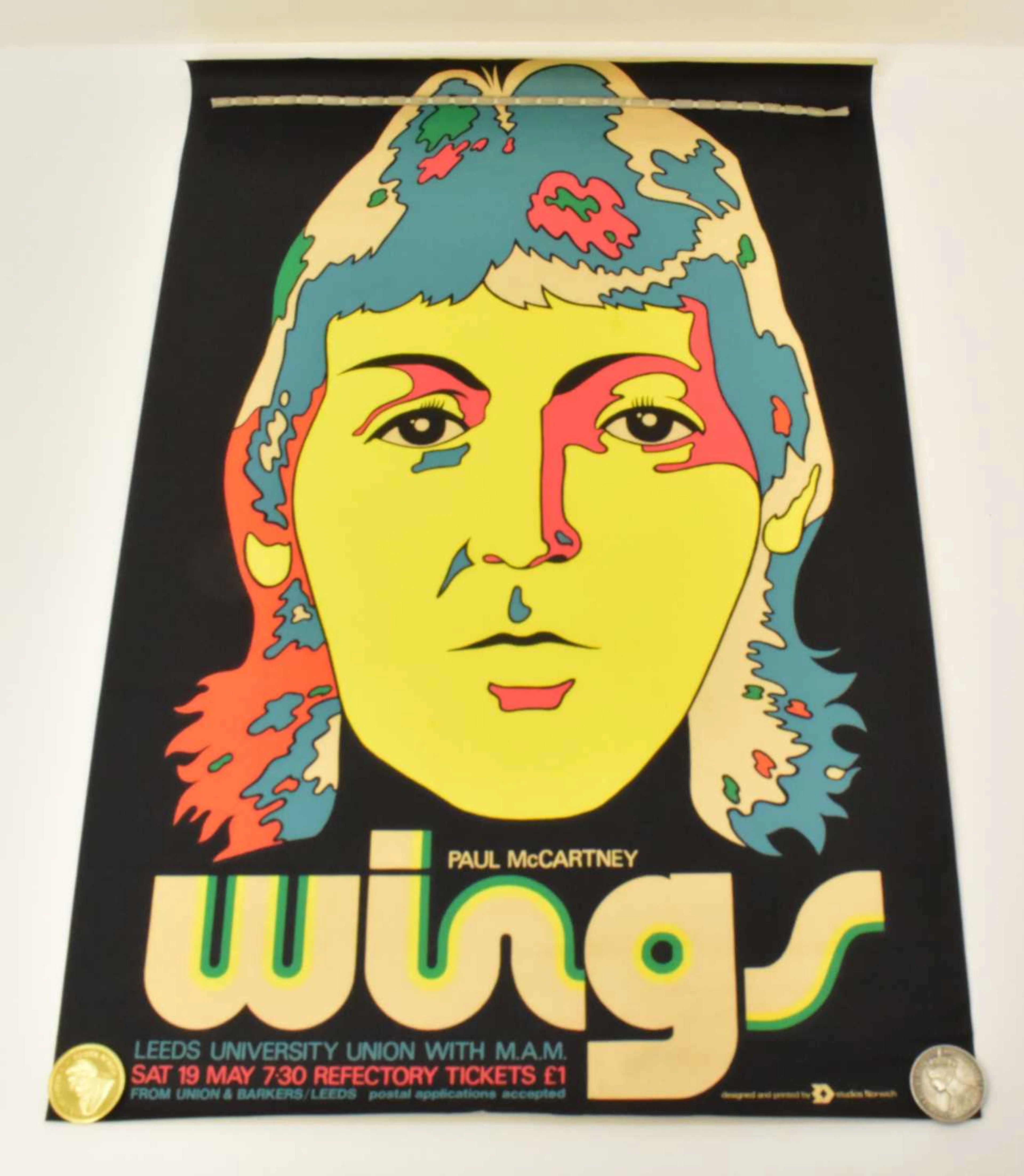 A vintage music poster advertising Paul McCartney 'Wings'...