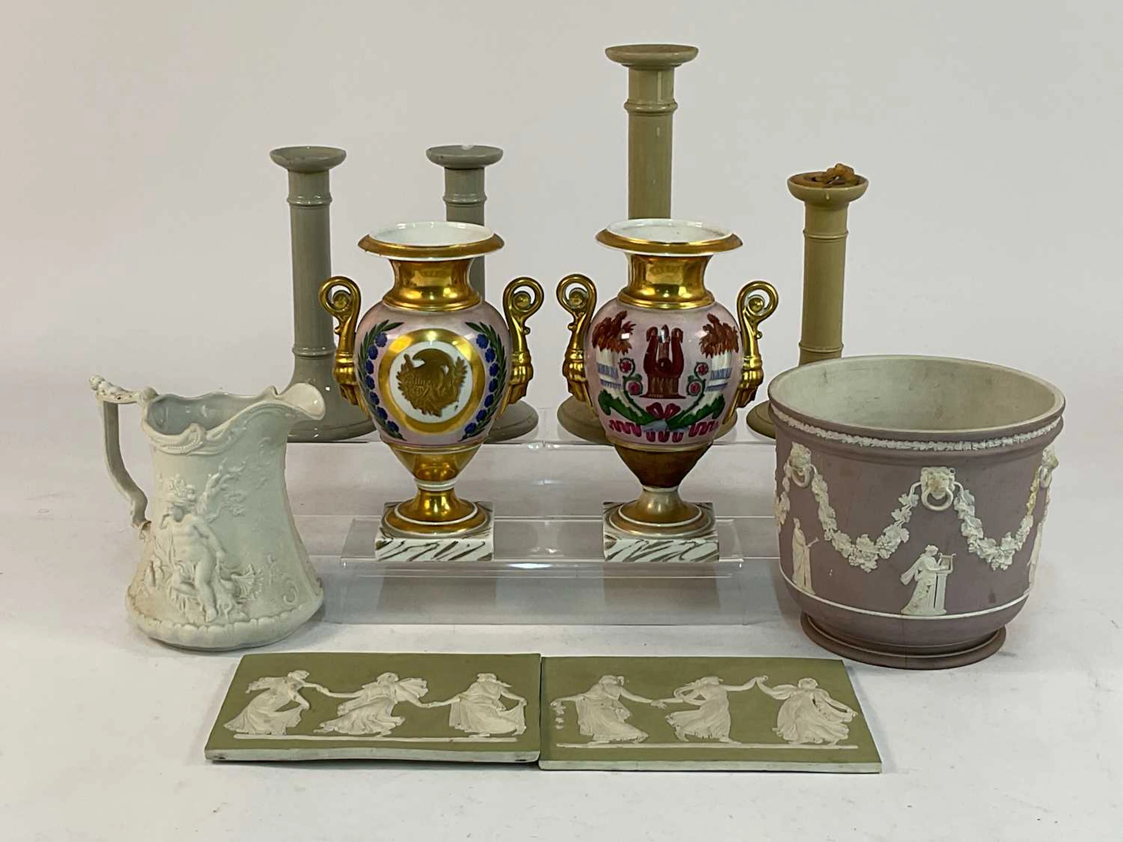 A pair of 19th century French Empire style porcelain urns
