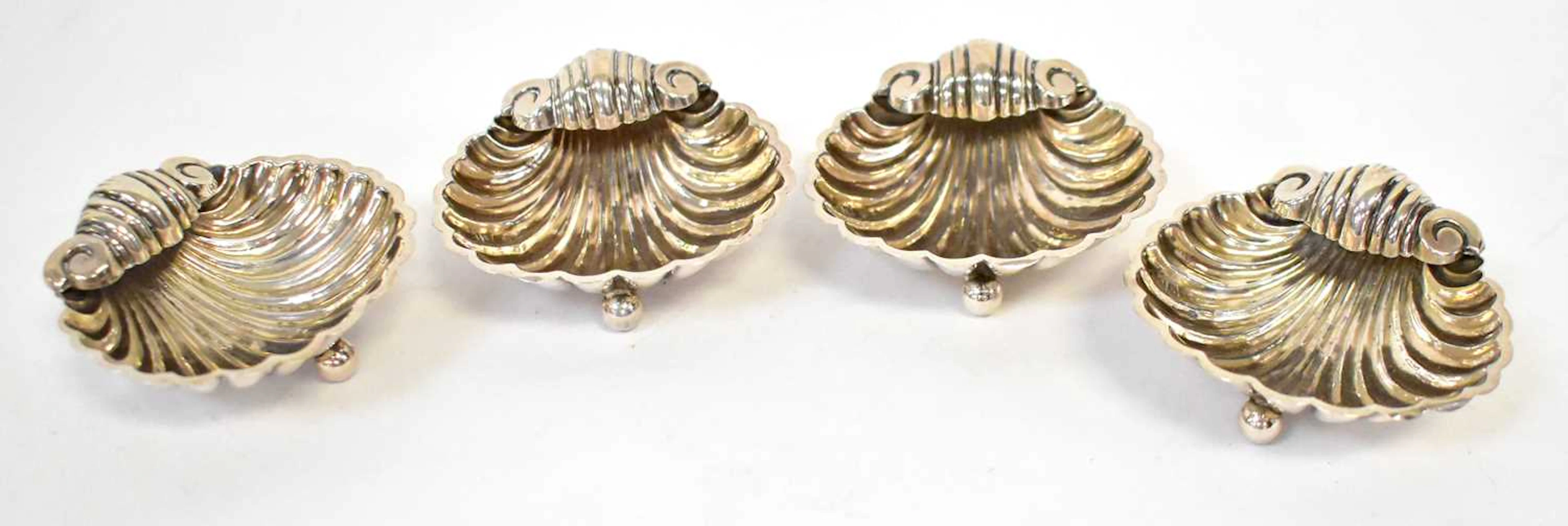 FLORENCE WARDEN; a set of four Victorian hallmarked silver salts