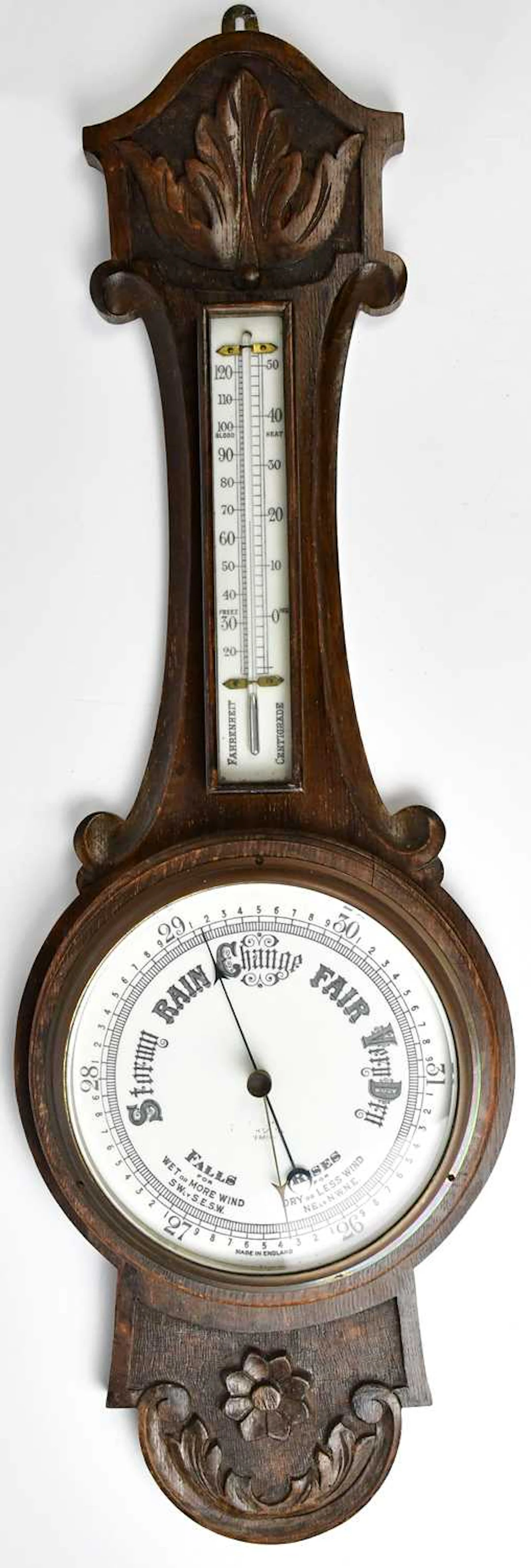 A 1930s oak cased banjo barometer with enamelled dial