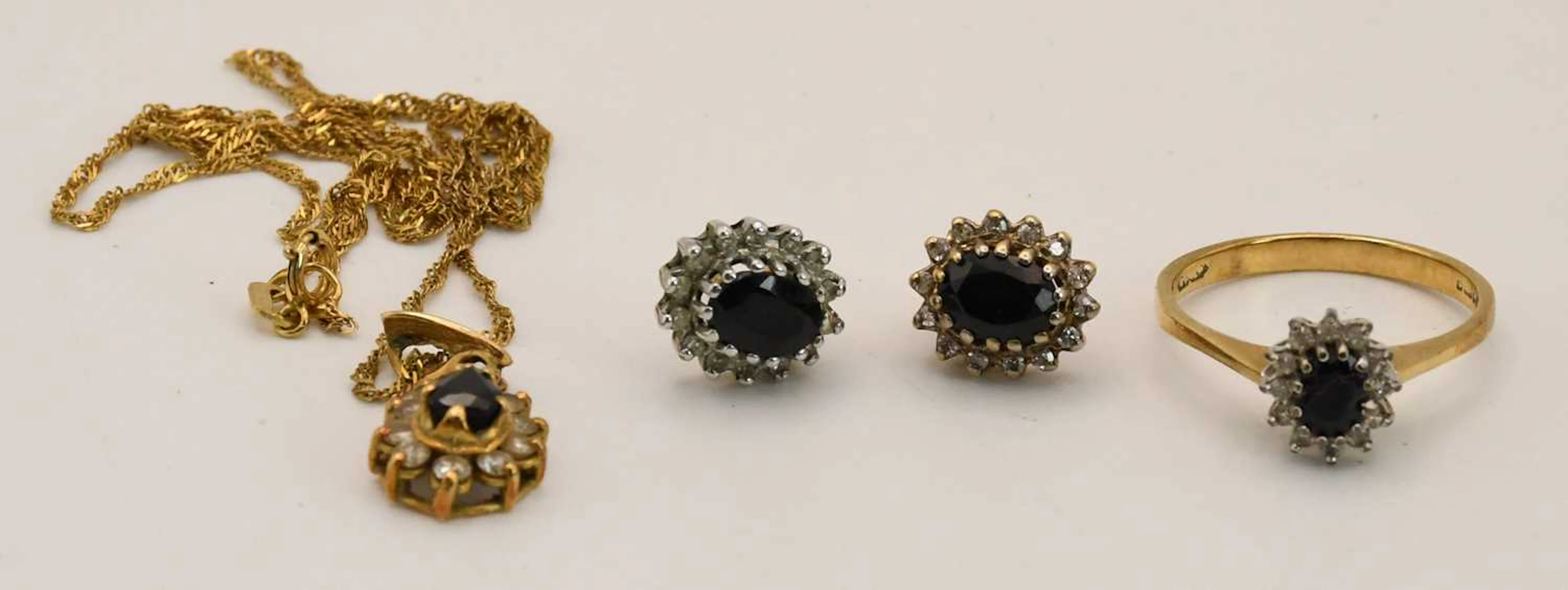 A 9ct yellow gold tiny diamond and central sapphire ring