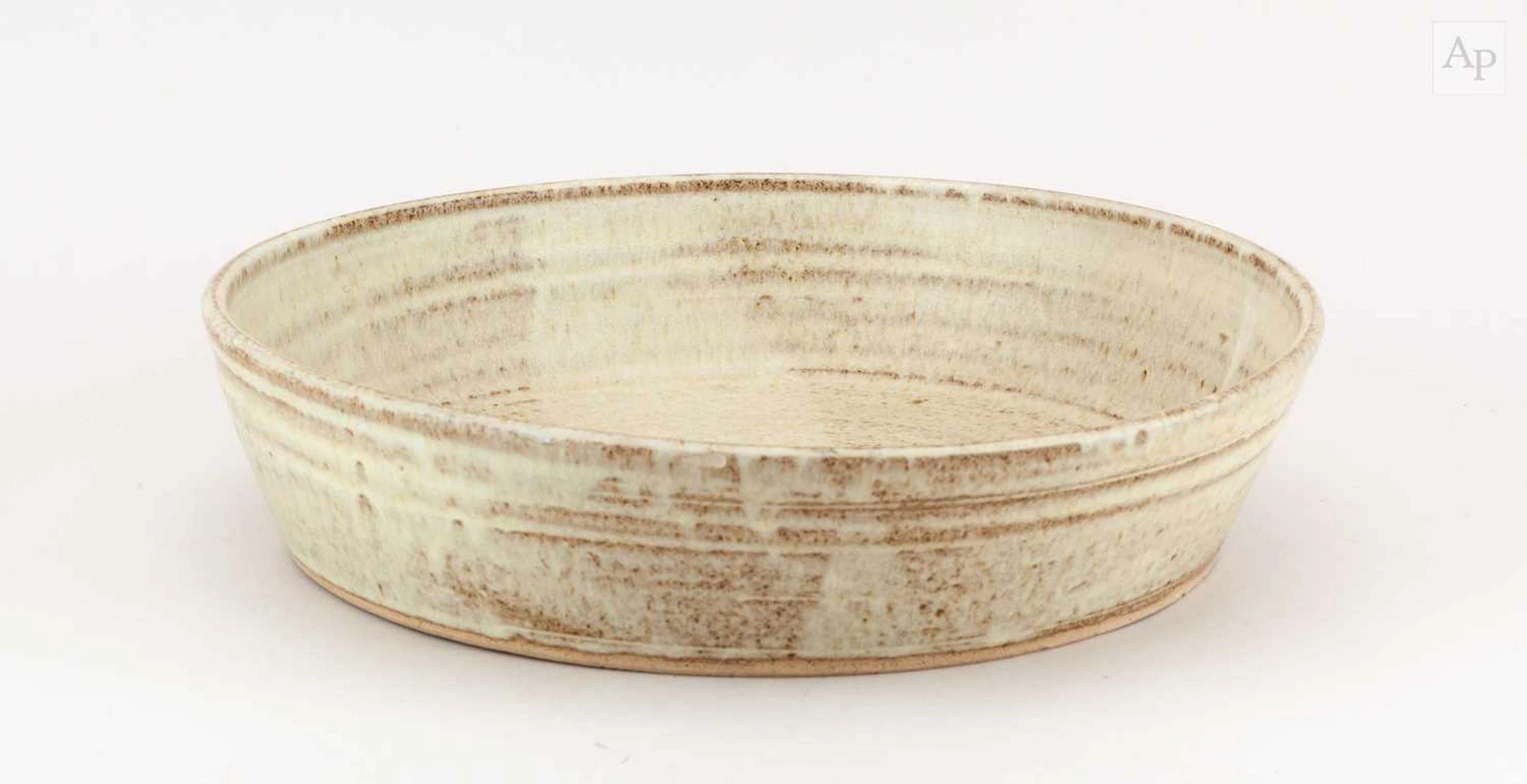 EMMANUEL COOPER (1938-2012); a large stoneware dish covered in oatmeal glaze