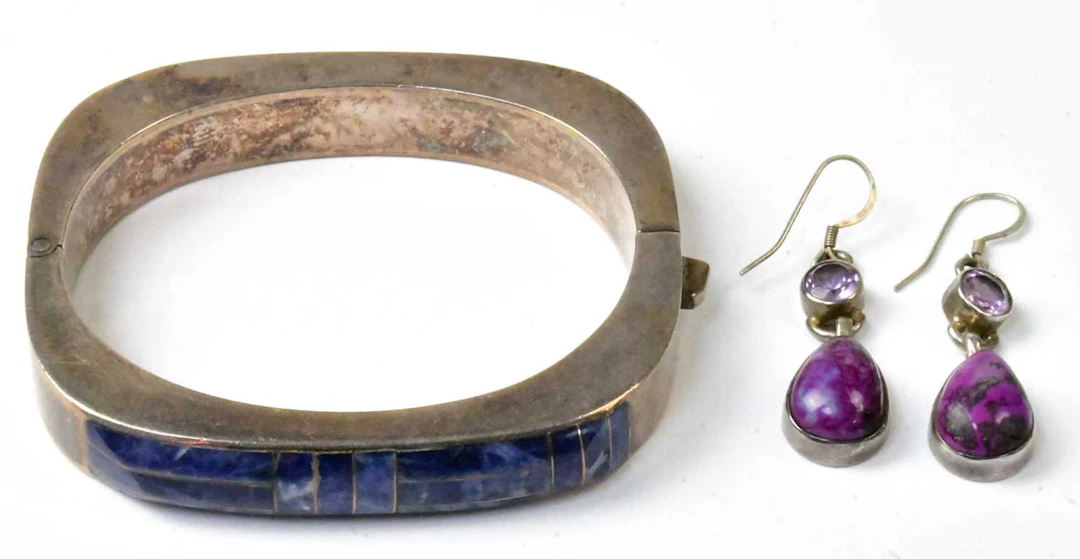 A Mexican 950 grade silver hinged bangle set with sodalite