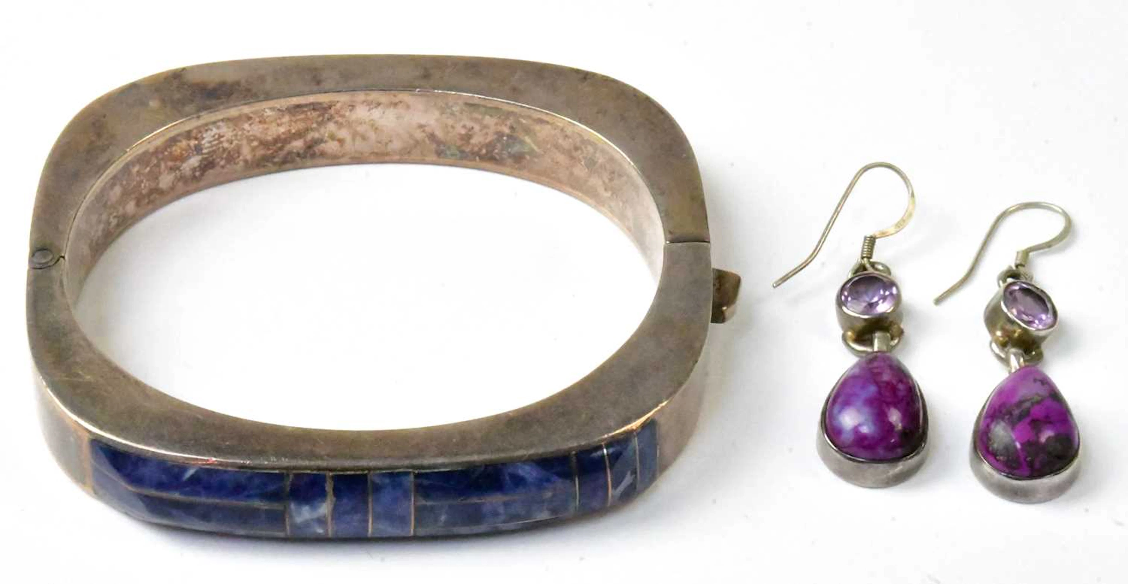 A Mexican 950 grade silver hinged bangle set with sodalite