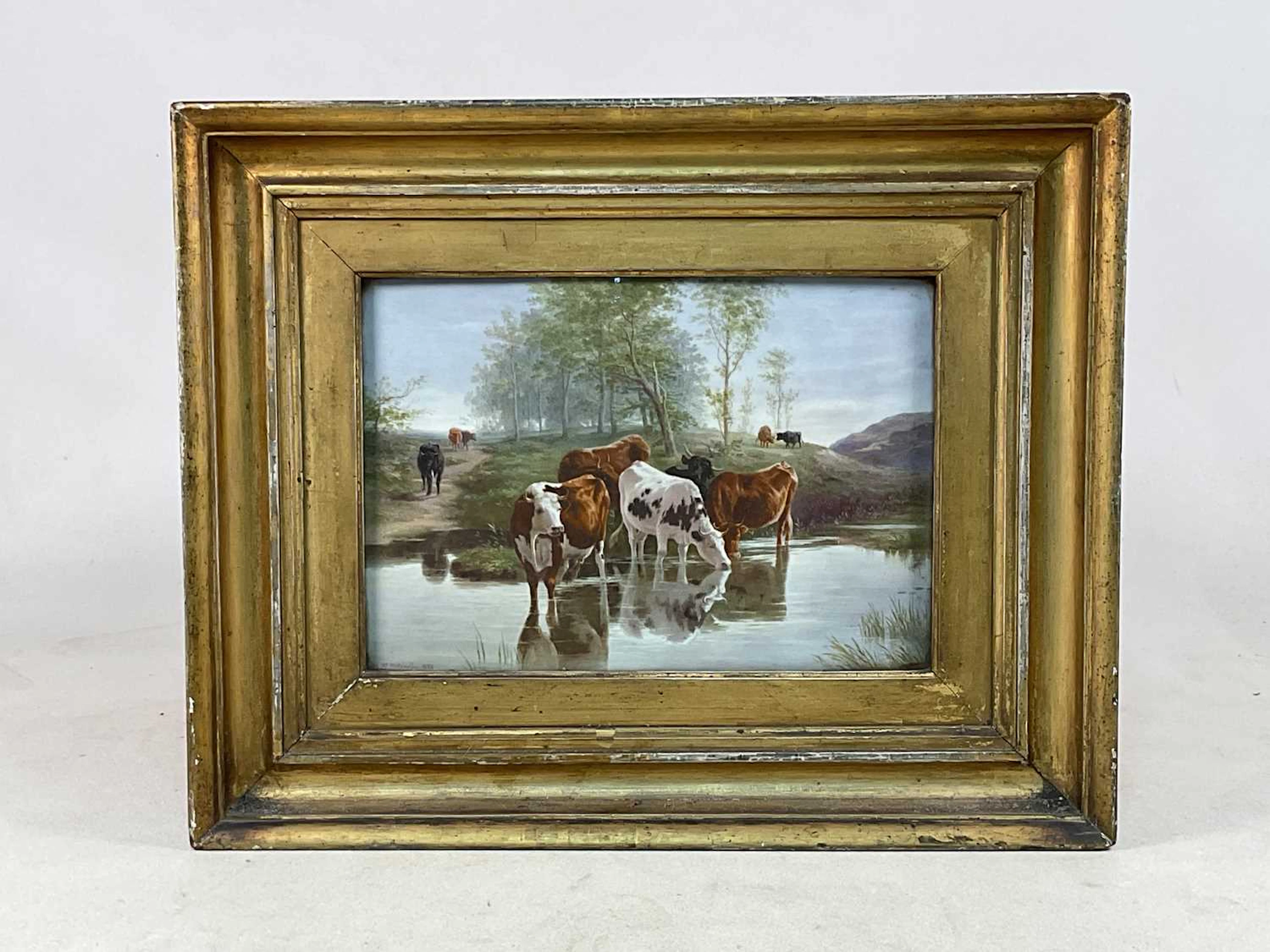 H MITCHELL; a painted porcelain plaque depicting cattle...