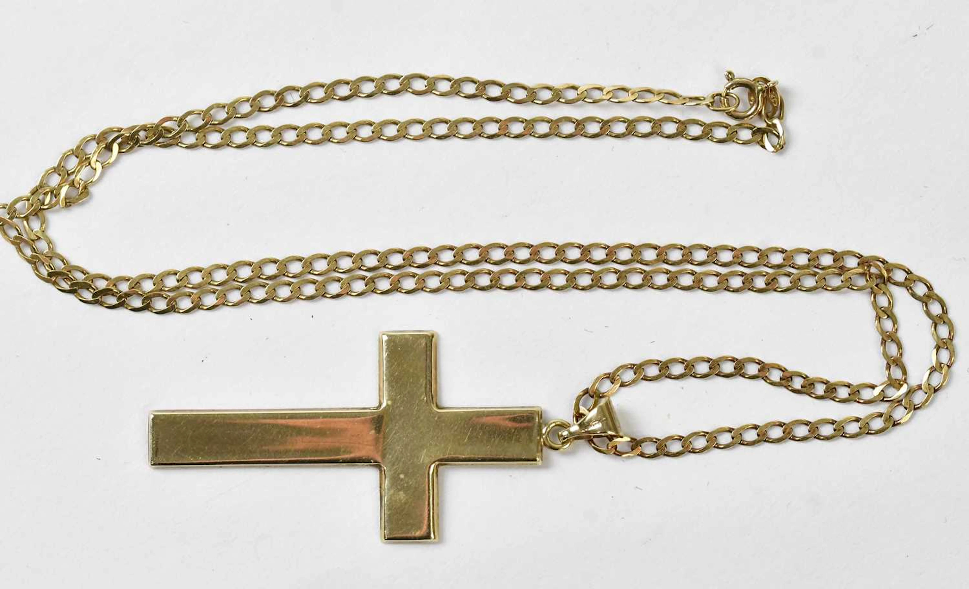 A large 9ct yellow gold cross pendant