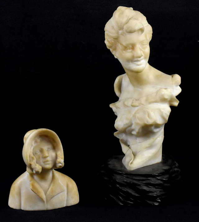 An Art Nouveau alabaster bust of a maiden wearing a bonnet hat