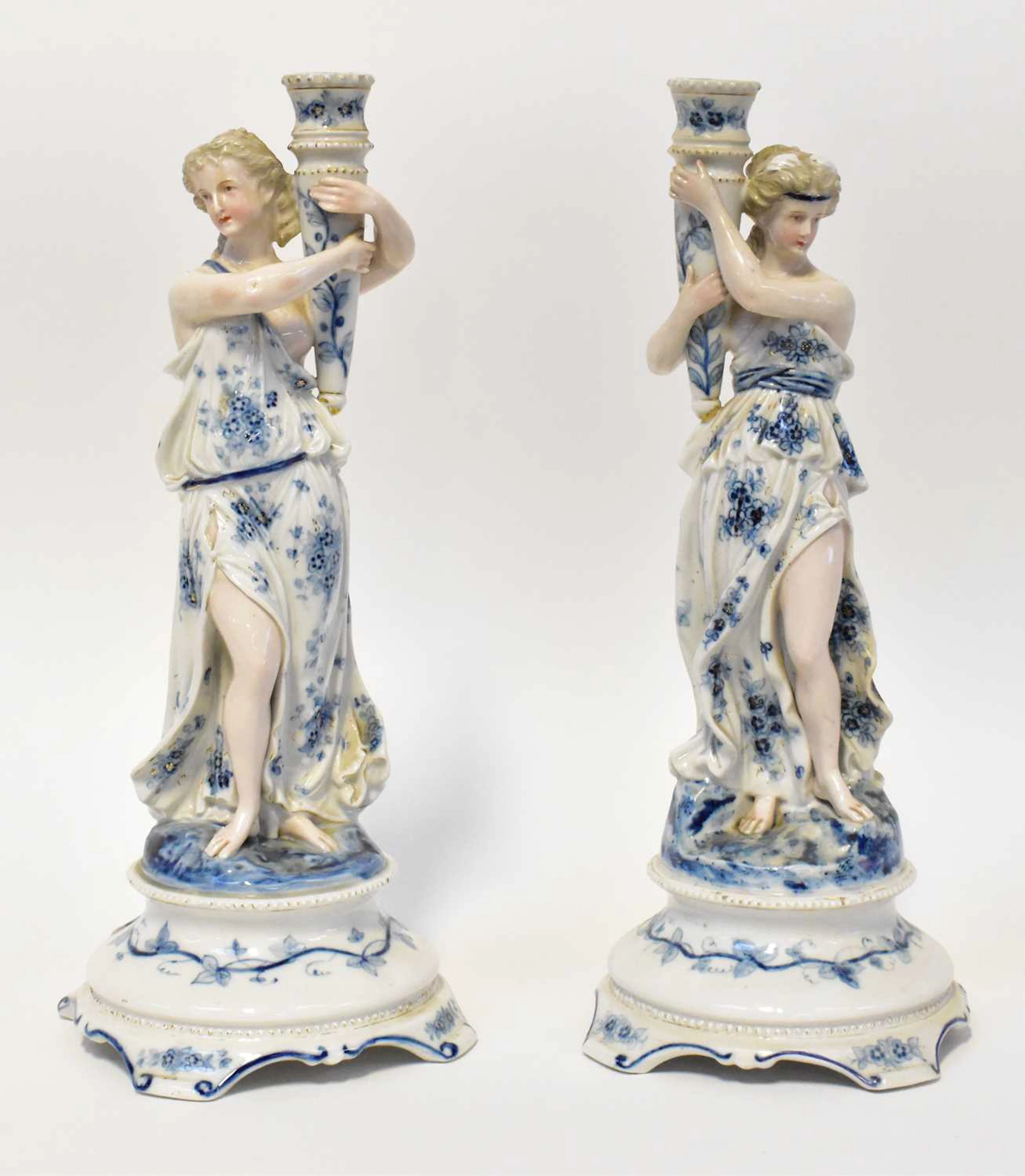 A pair of Meissen-style 19th century Continental porcelain figural candlesticks