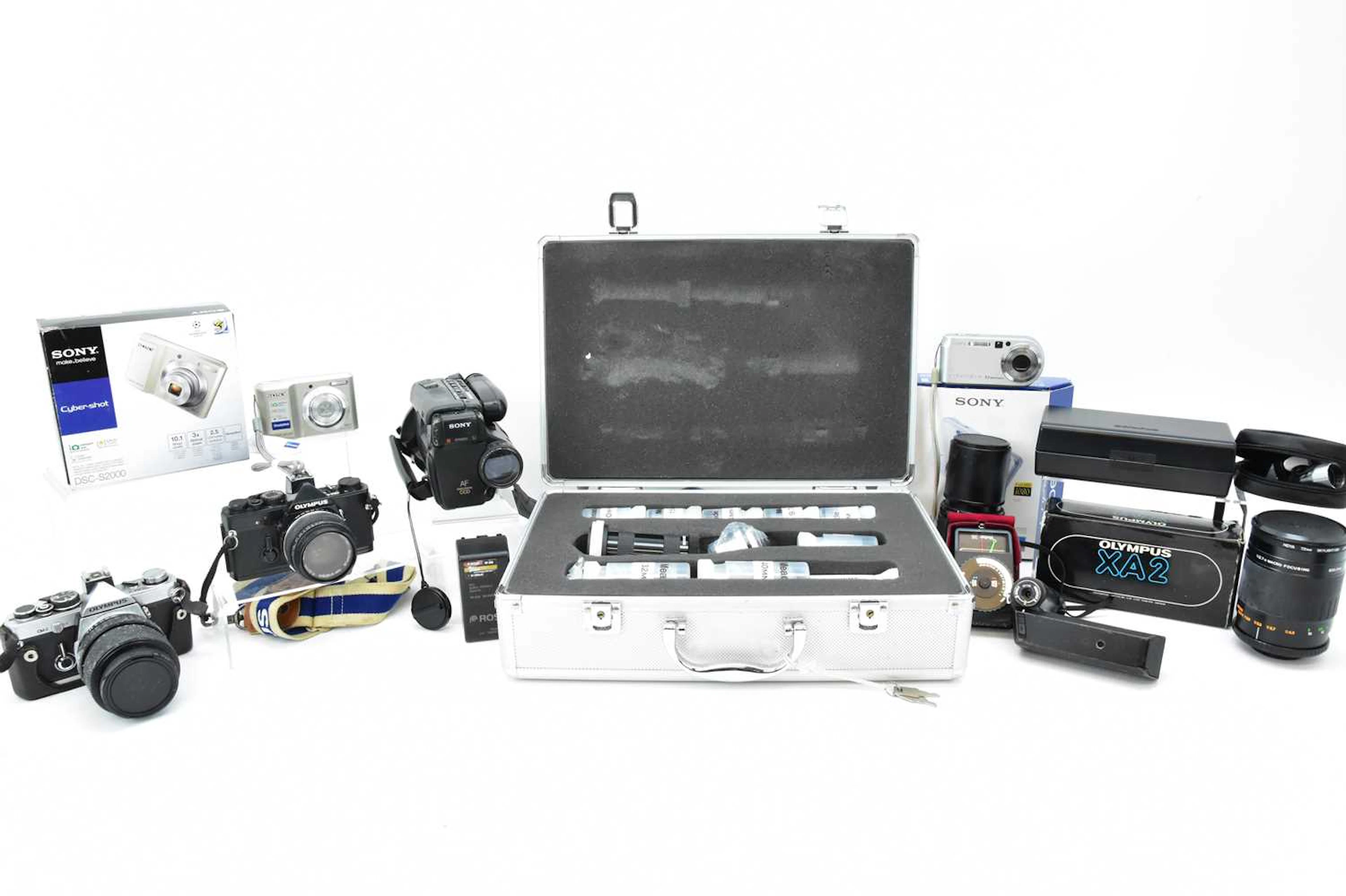 Various modern and vintage cameras and various lenses