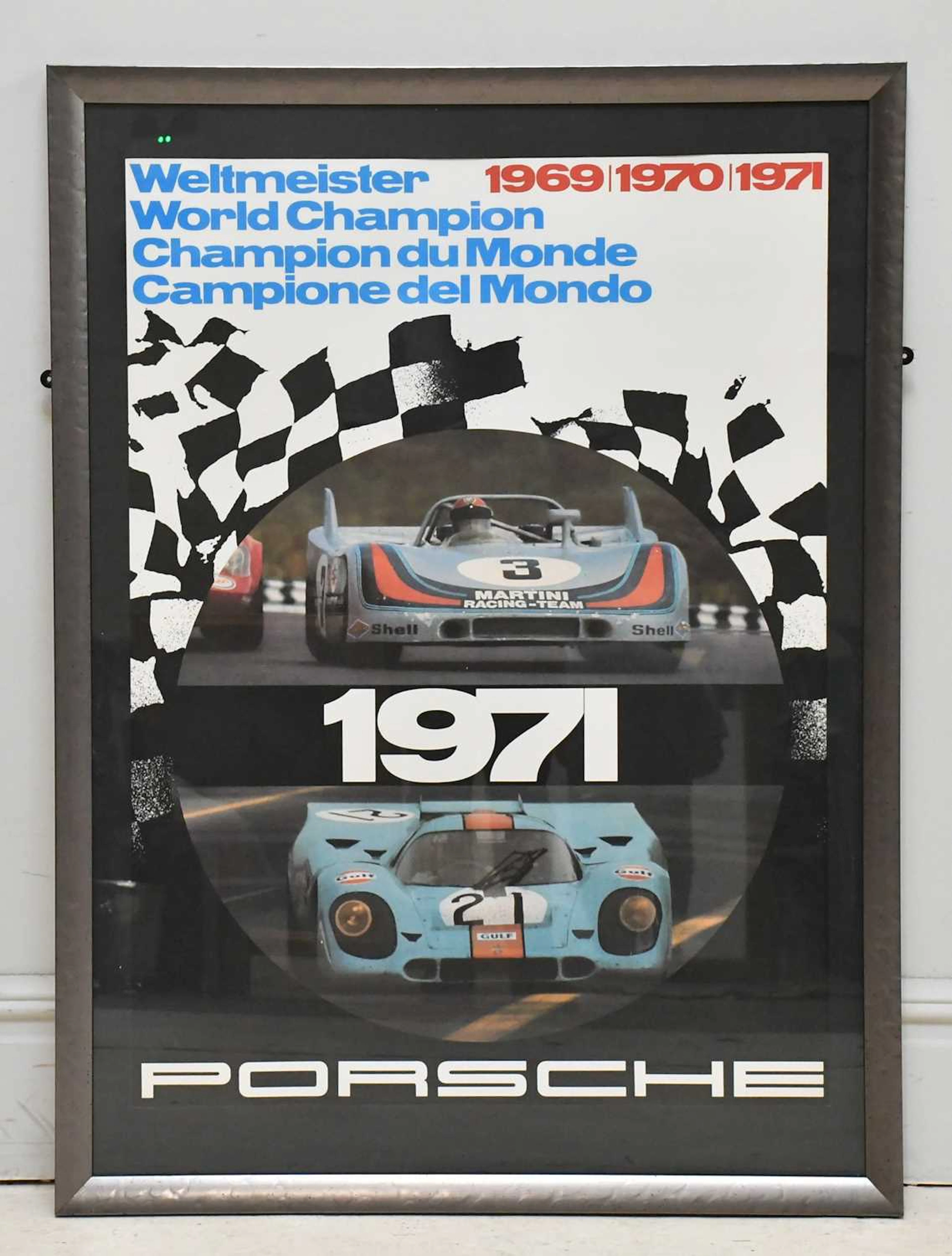 PORSCHE; a large framed poster commemorating the sports...