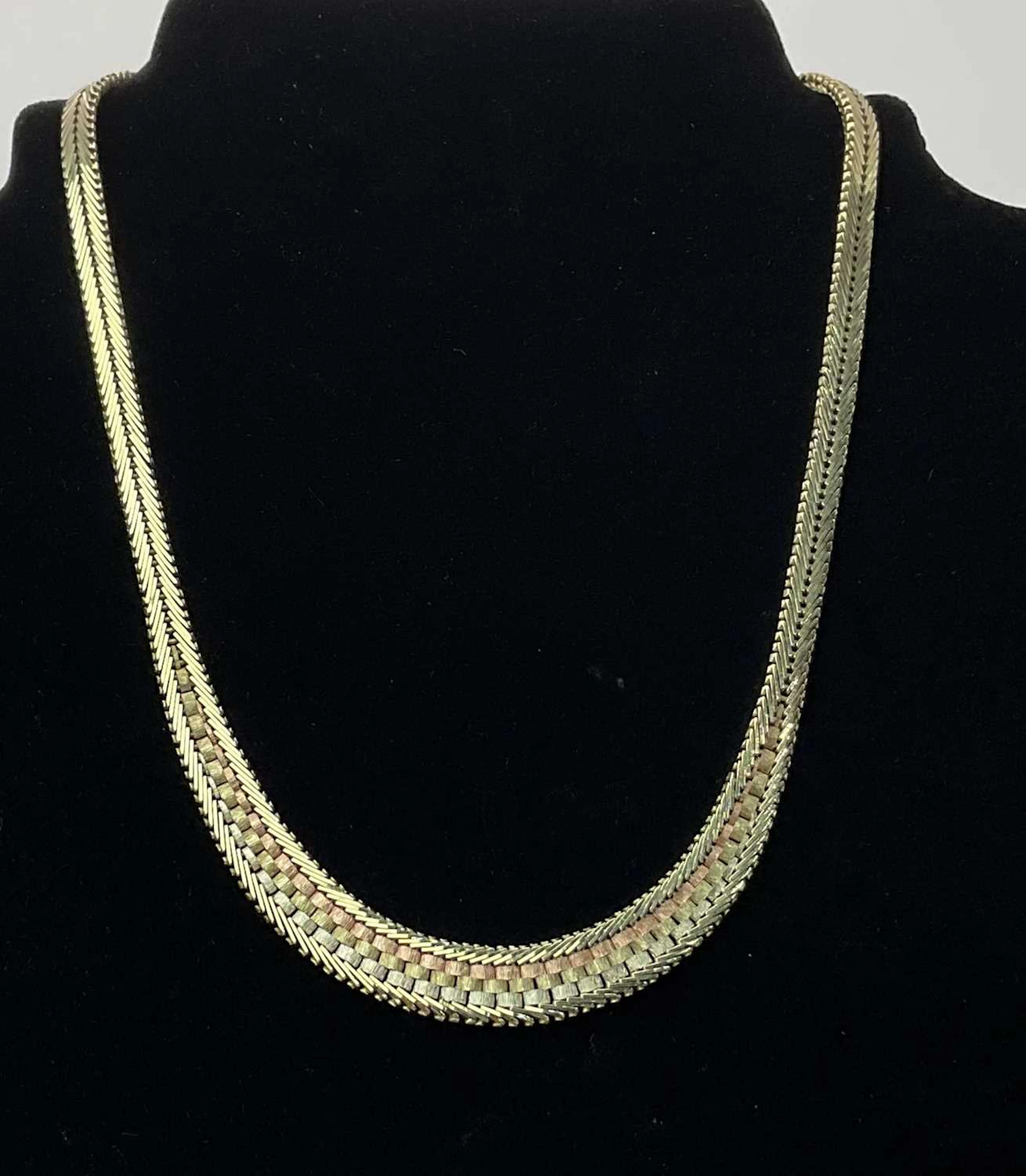 A 9ct tricolour gold bracelet semi rigid necklace