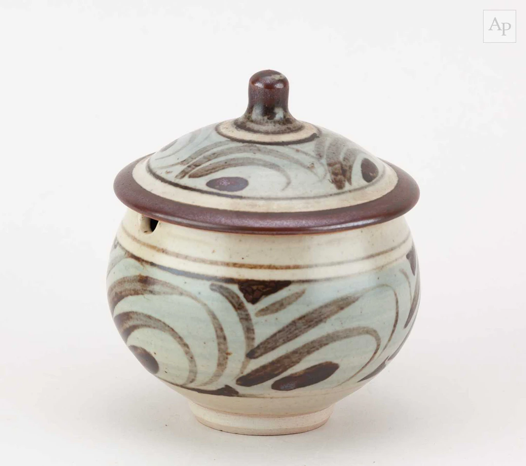 Leach Pottery; a stoneware marmalade jar partially washed...