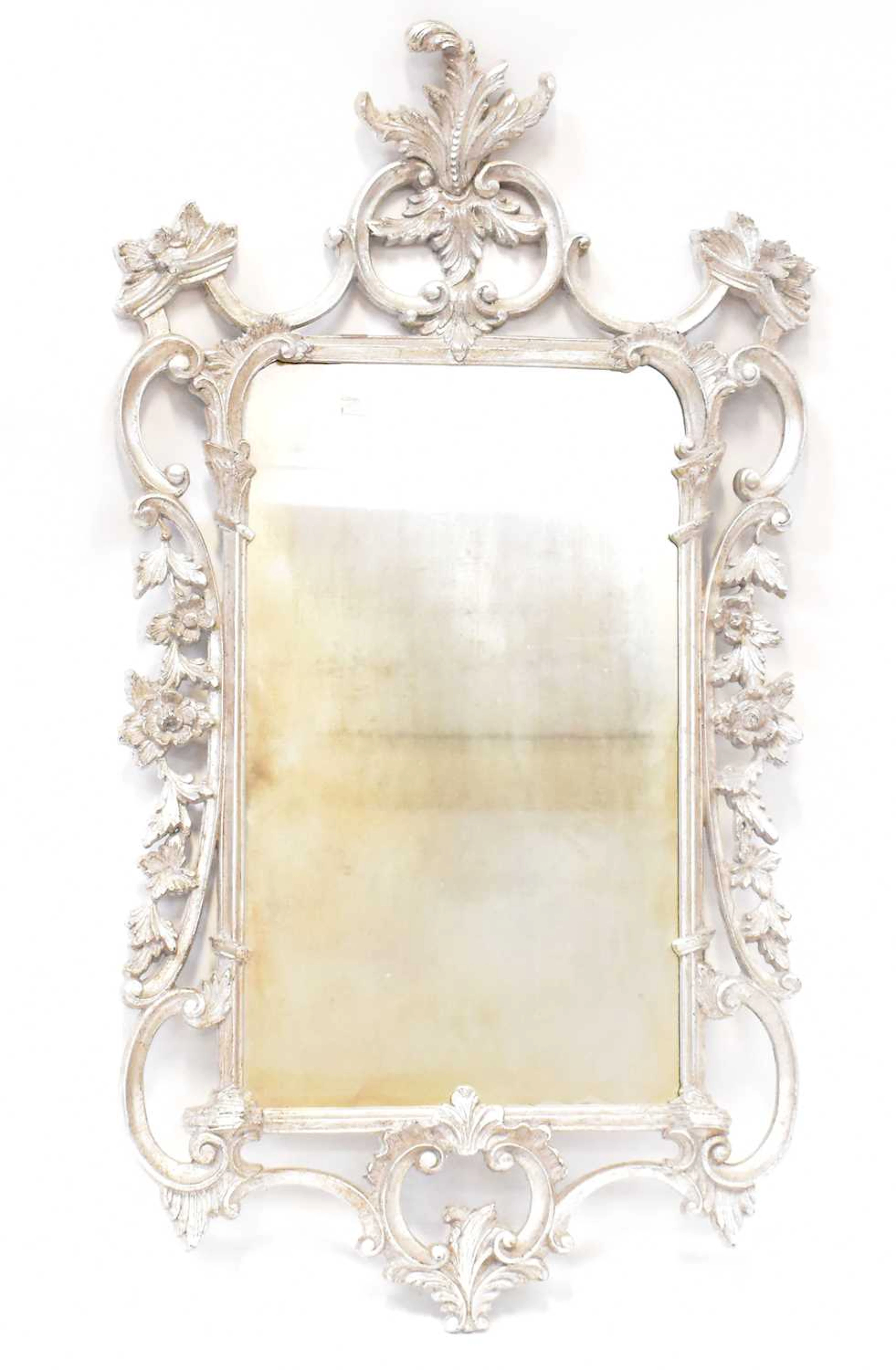 A modern Rococo style silver coloured framed wall hanging mirror
