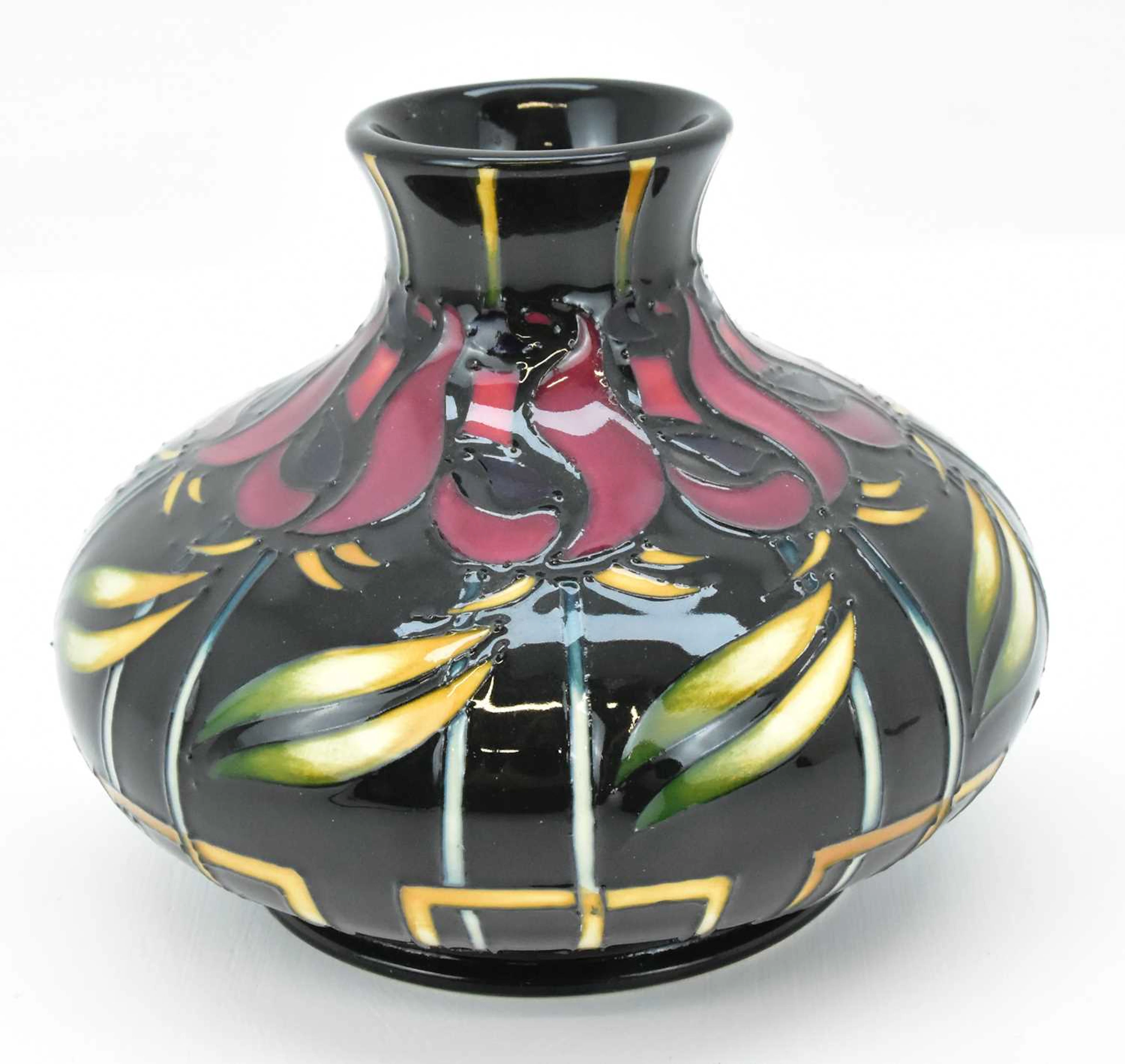 MOORCROFT; a 'Night Rose' squat vase in the Mackintosh style on a dark ground