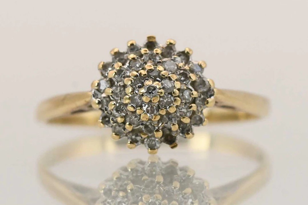 A 9ct yellow gold tiny diamond cluster ring
