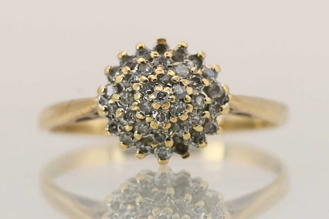 A 9ct yellow gold tiny diamond cluster ring