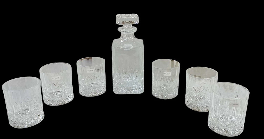 ROYAL DOULTON; a cased crystal glass decanter