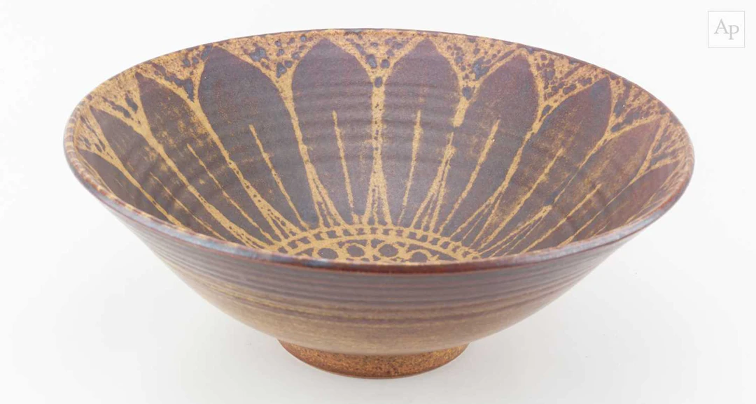 PETER LANE (born 1932); a large stoneware bowl covered in...