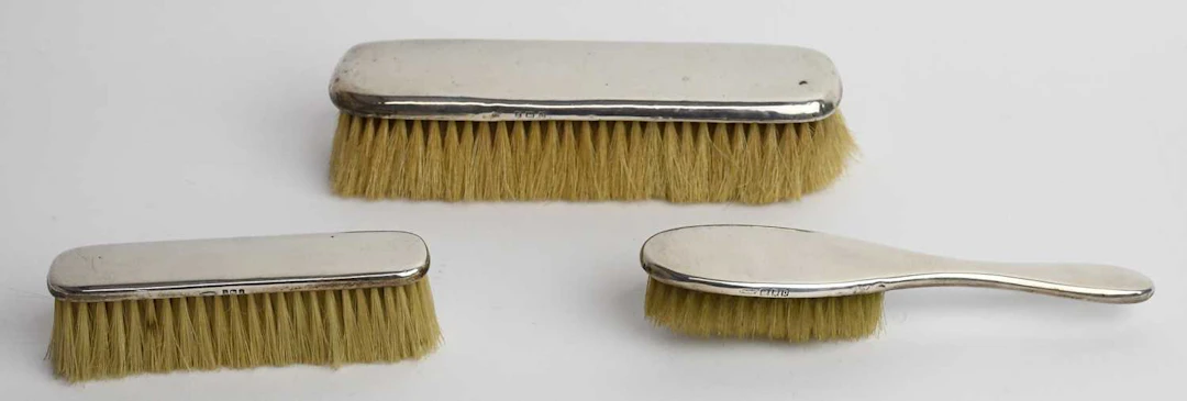 A George VI hallmarked silver mounted dressing table brush