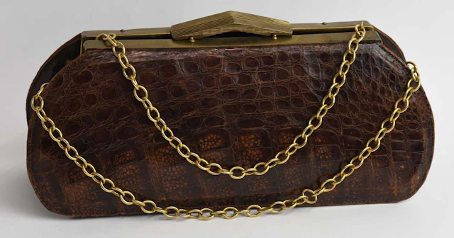 A vintage lady's brown alligator skin leather evening shoulder bag