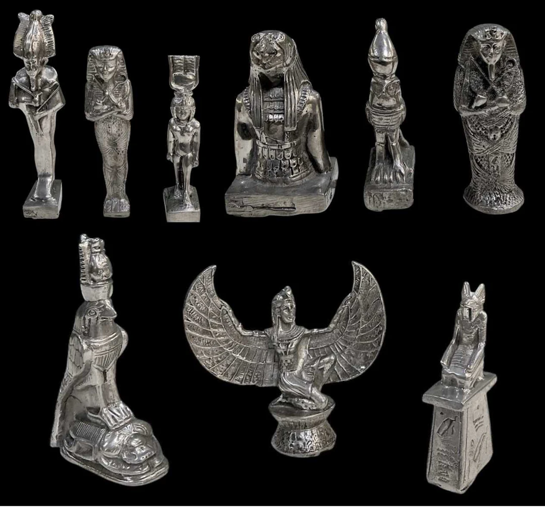 Nine assorted miniature Egyptian Revival pewter figures