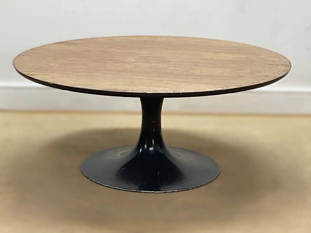 MAURICE BURKE FOR ARKANA; a tulip coffee table with black...