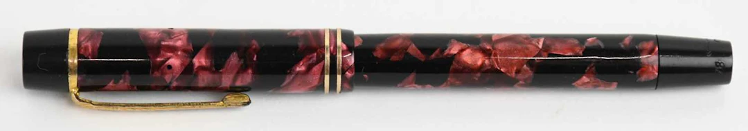 MENTMORE; a 1930s/40s red and black bakelite plastic gold...