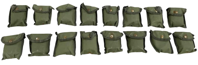 A collection of sixteen modern green canvas cased military compasses