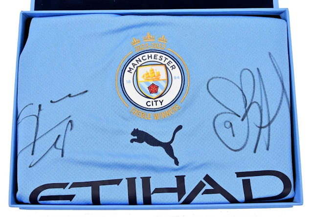 MANCHESTER CITY INTEREST; a rare boxed treble winners 2022/23 replica jersey